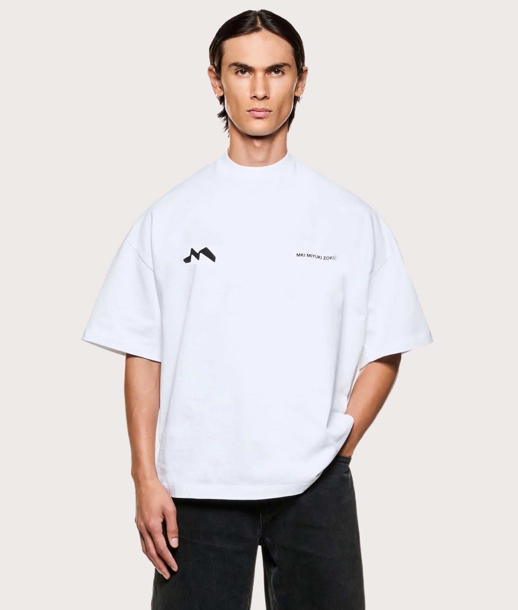 MKI MIYUKI ZOKU Silhouette T-Shirt in White at EQVVS Menswear. Model front shot.