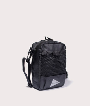 and wander Ecopak Shoulder Pouch Bag in black with mesh pocket. EQVVS Angled Shot