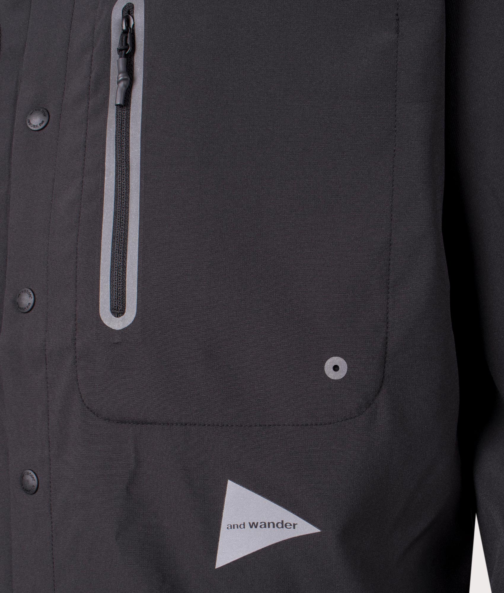and wander Tech Shirt in Black. Shot at EQVVS. Front logo shot 