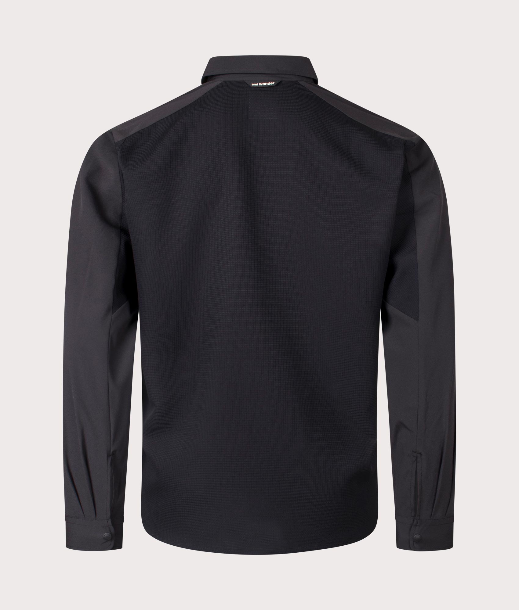 and wander Tech Shirt in Black. Shot at EQVVS. Back shot 