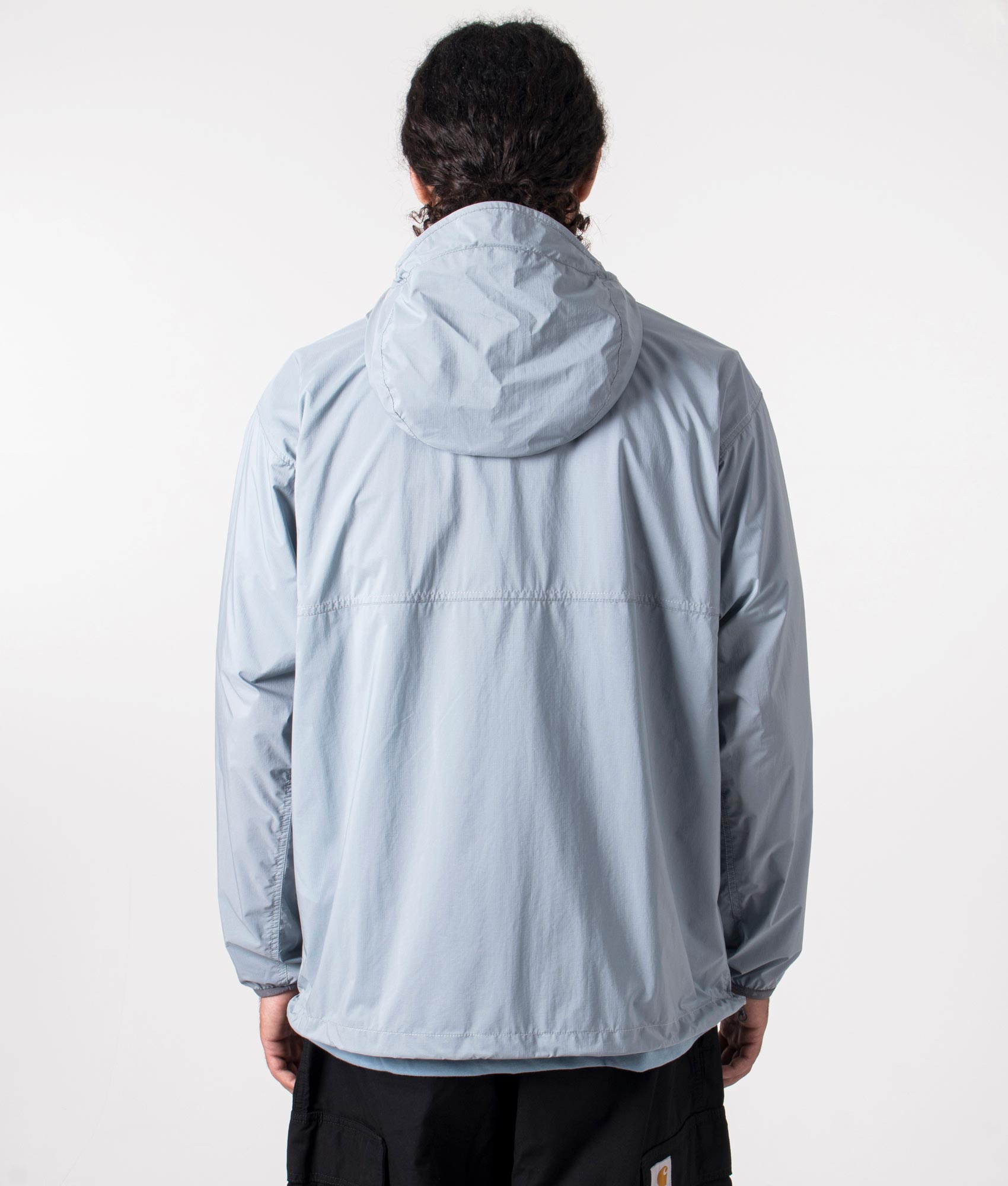 Nylon pertex jacket in light blue by and wander. shot at EQVVS. Reverse shot. 
