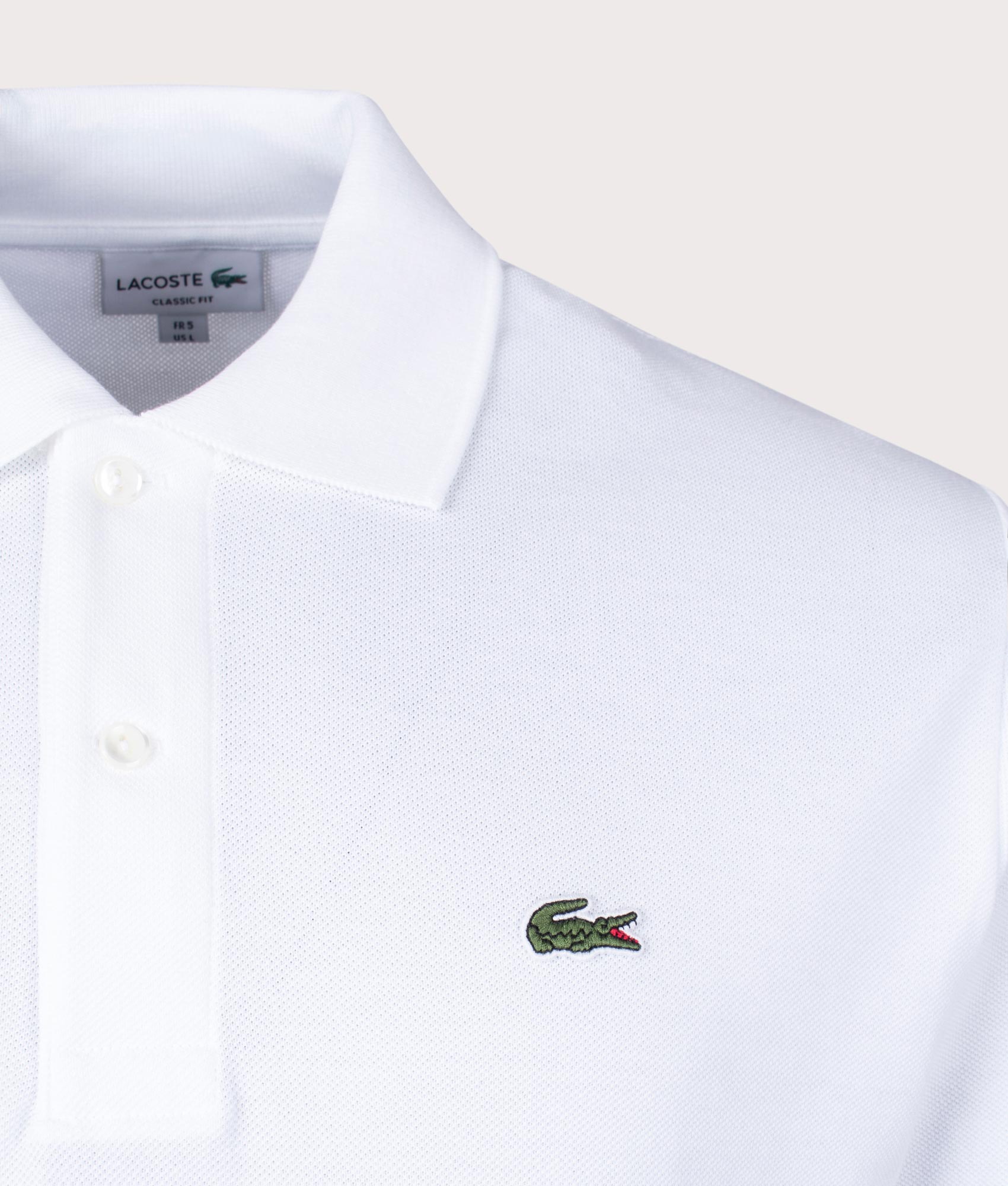 Lacoste L1212 Croc Polo Shirt White at EQVVS Menswear. Detail shot.