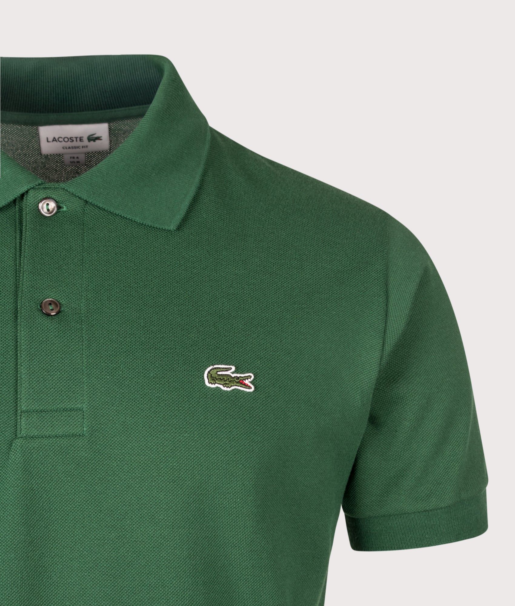 Lacoste Classic Fit L1212 Croc Logo Polo Shirt in Pine Green at EQVVS Menswear. Detail shot.