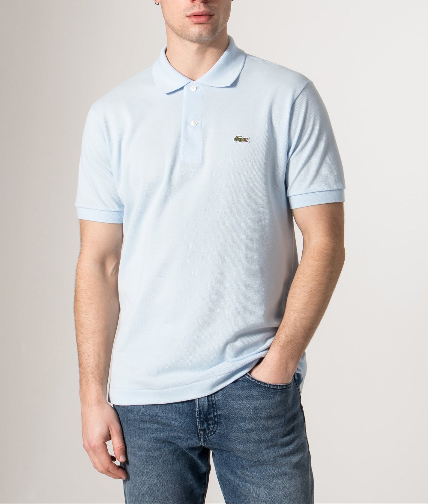 Lacoste Croc Logo L1212 Polo Shirt in Light Blue at EQVVS Menswear. Model front shot. 