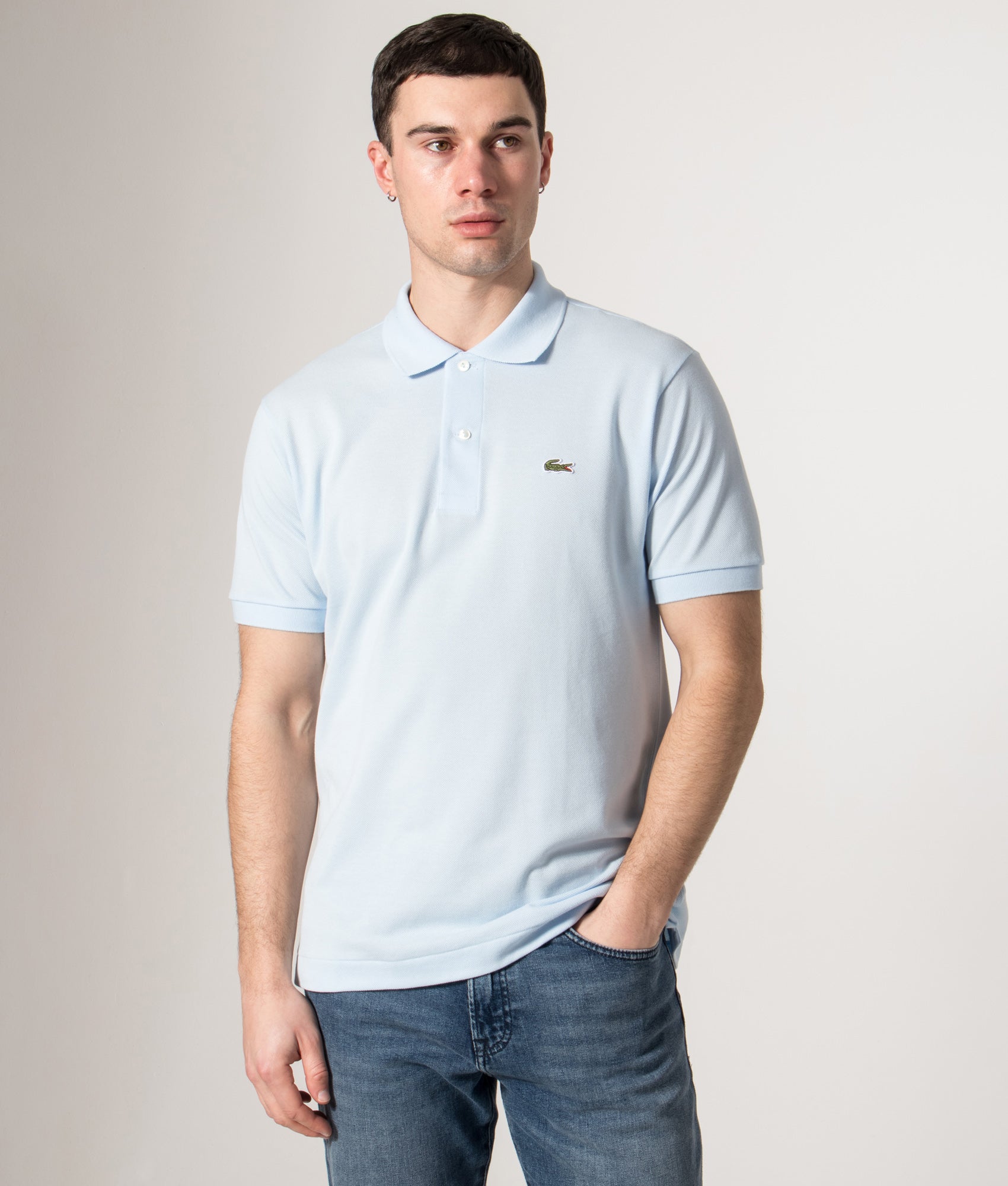 Lacoste Croc Logo L1212 Polo Shirt in Light Blue at EQVVS Menswear. Model front shot. 