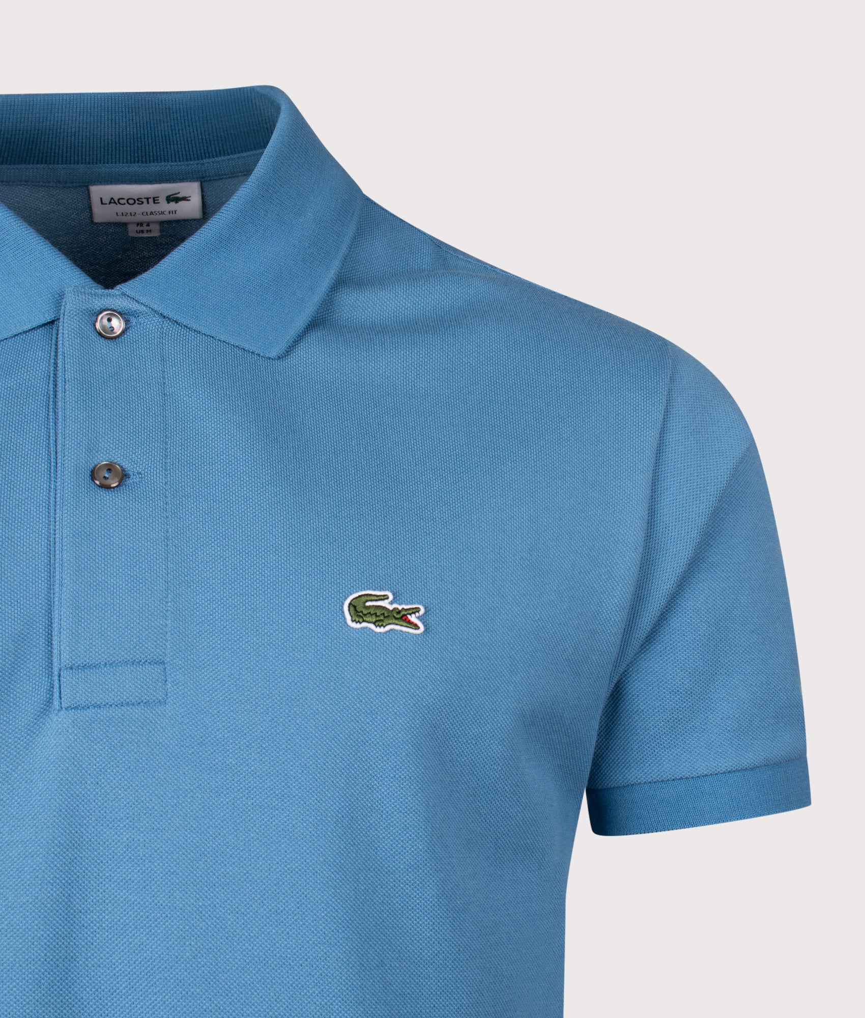 Lacoste Classic Fit L1212 Croc Logo Polo Shirt in Abyss Blue at EQVVS Menswear. Detail shot.