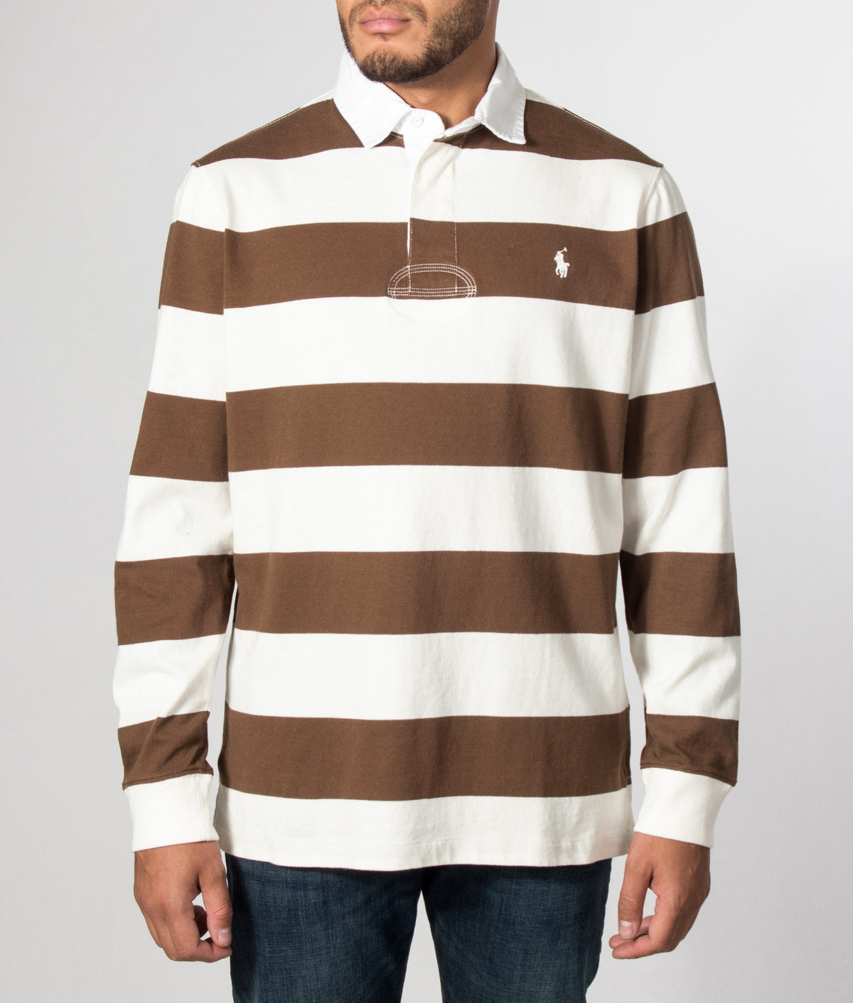 Polo Ralph Lauren Classic Fit The Iconic Striped Rugby Shirt in Trophy Cream and Chocolate Brown at EQVVS Menswear. Model front shot.