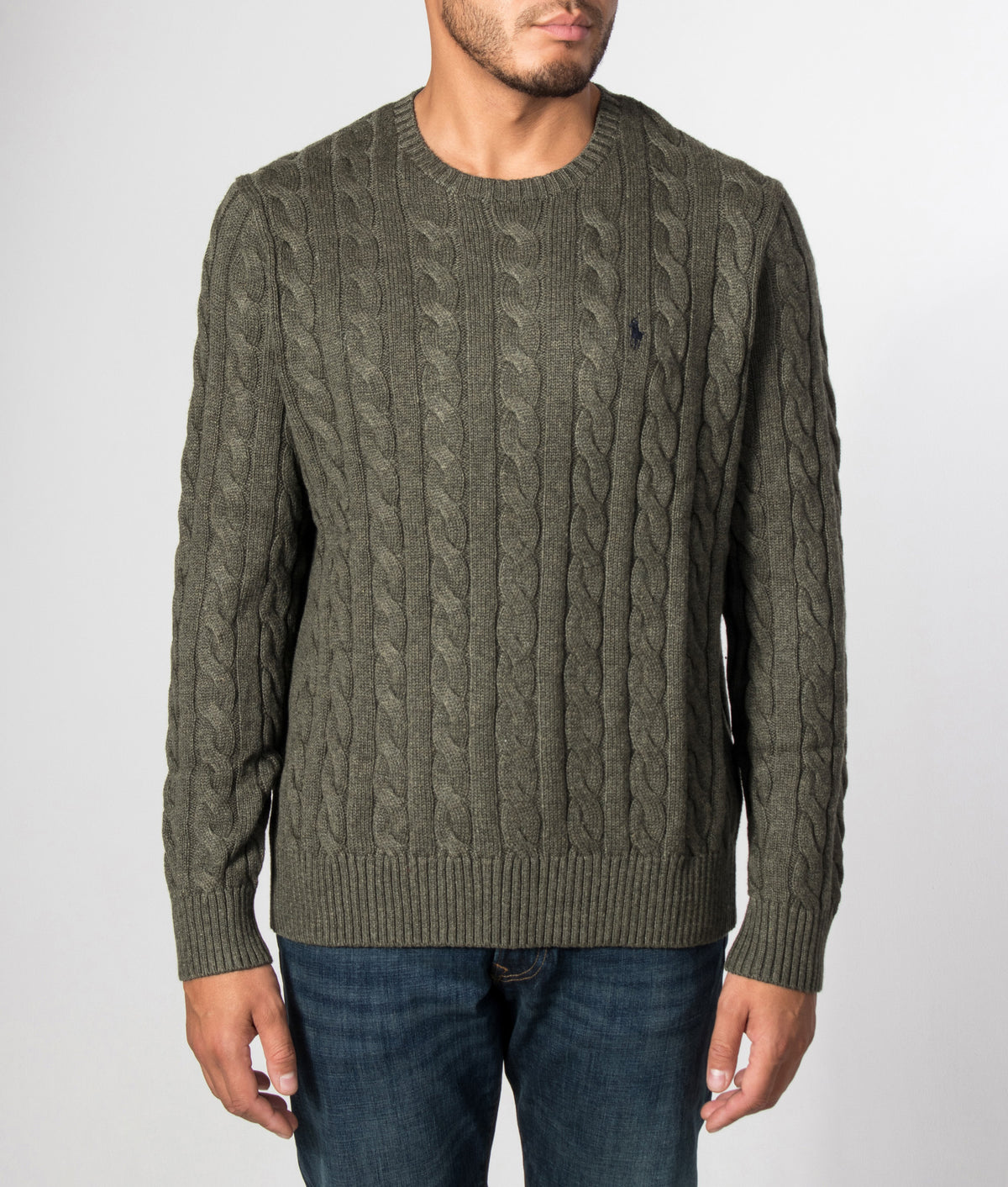 Polo Ralph Lauren Regular Fit Cable Knit Cotton Jumper in Olive Shrub Heather at EQVVS Menswear. Model front shot.