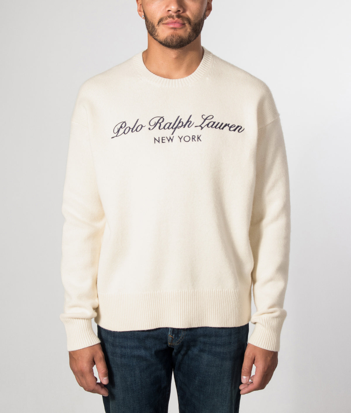 Polo Ralph Lauren Relaxed Fit Wool Blend Knitted Jumper in Andover Cream at EQVVS Menswear. Model front shot.