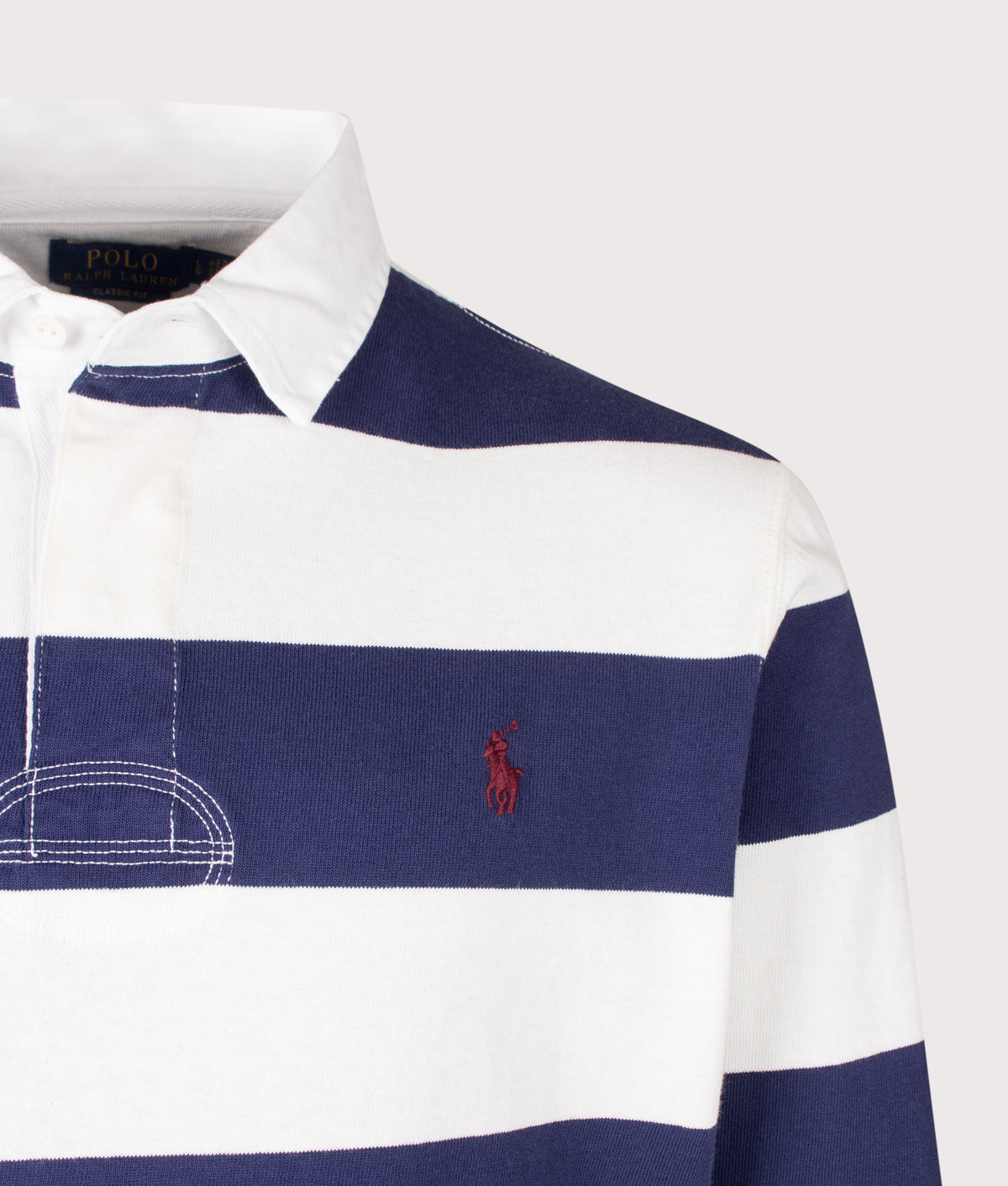 Polo Ralph Lauren Classic Fit The Iconic Striped Rugby Shirt in Trophy Cream and Balthus Navy at EQVVS Menswear. Detail shot.