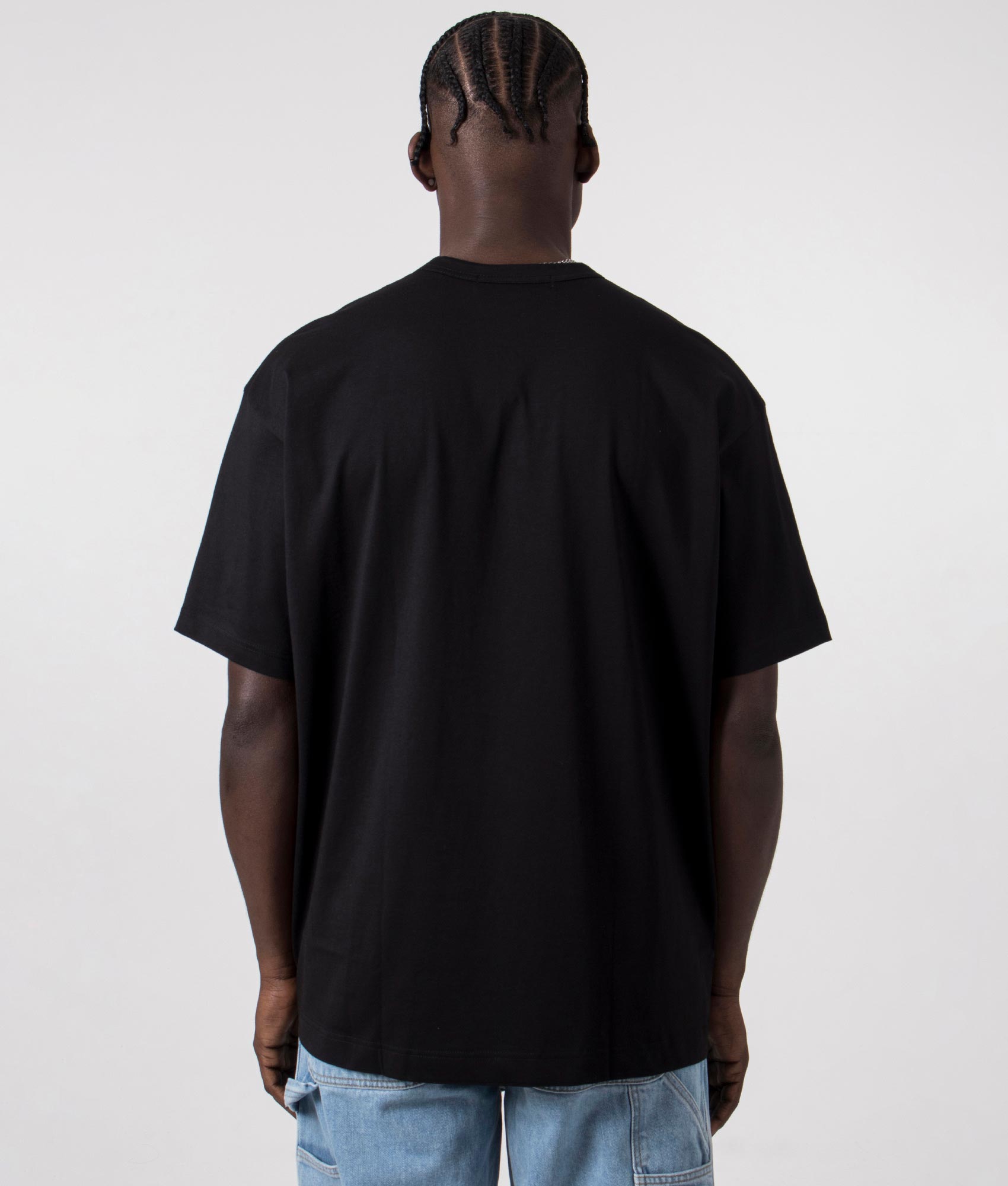 CDG Script Hem Logo T-Shirt in Black. Black angle shot at EQVVS.