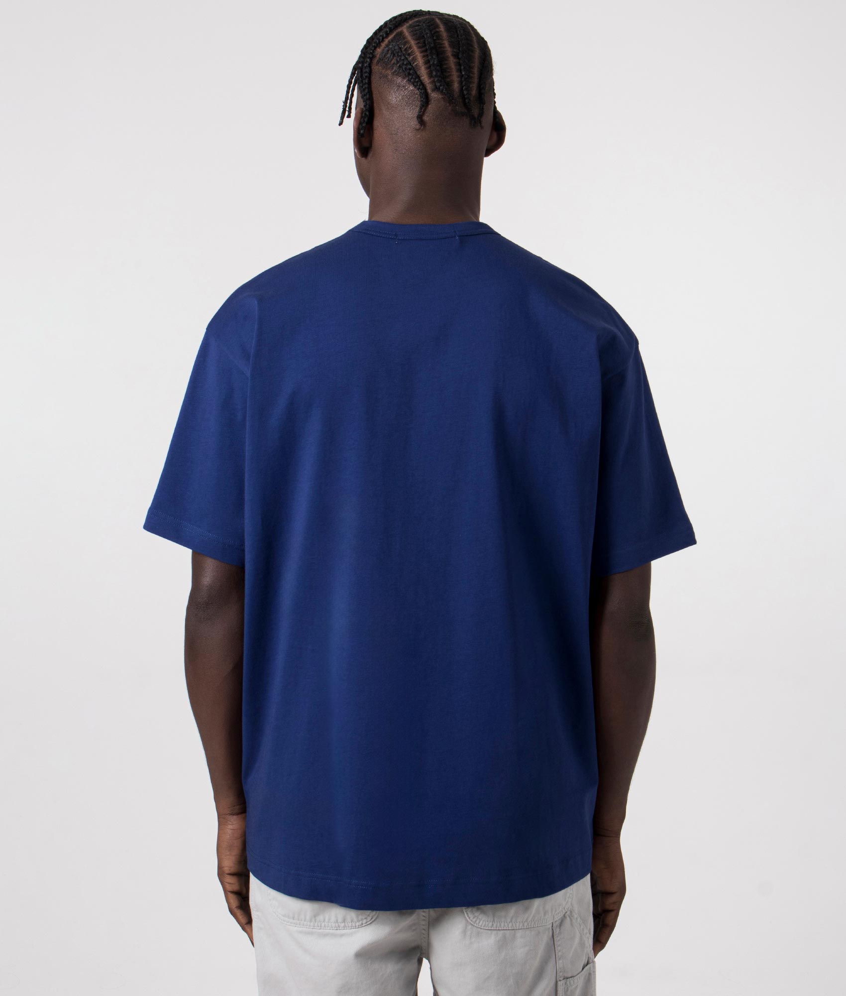 CDG Script Hem Logo T-Shirt in navy. Back angle shot at EQVVS.
