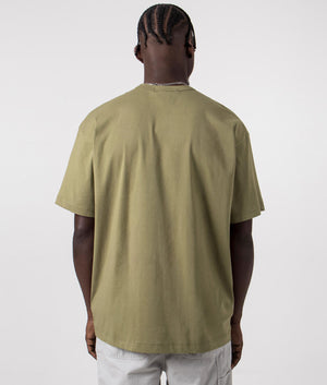 CDG Script Hem Logo T-Shirt in Khaki. Back angle shot at EQVVS.