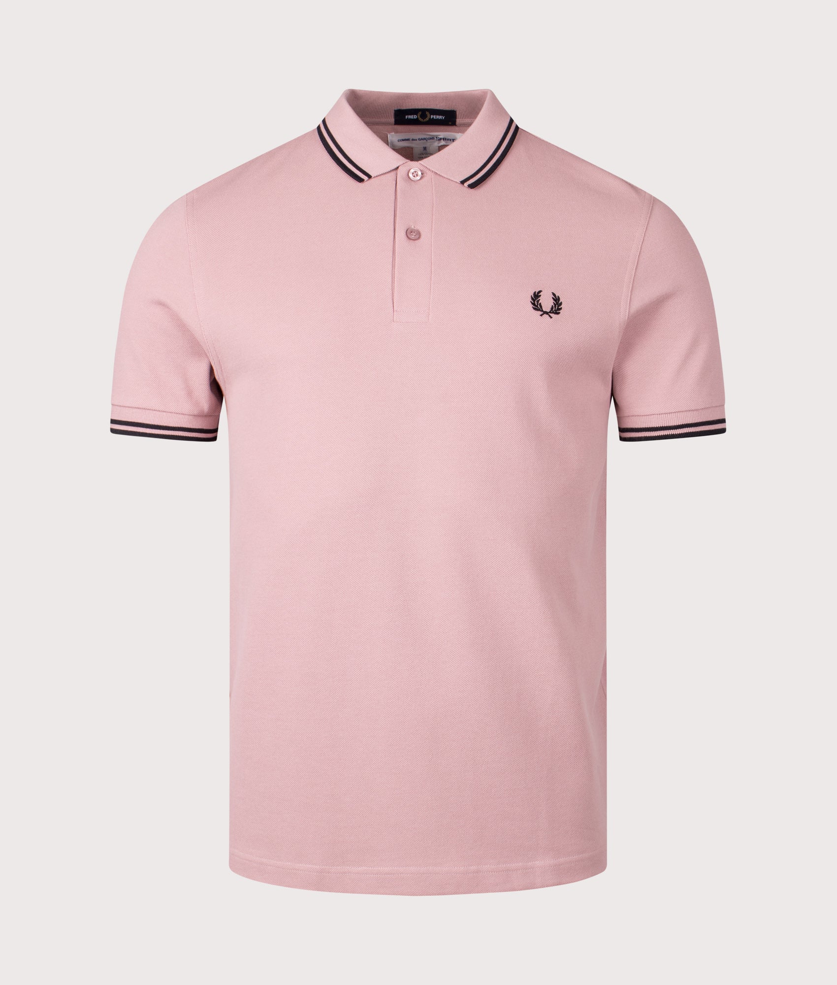 COMME des GARÇONS x Fred Perry Freedom is Energy Polo Shirt. Shot by EQVVS. Front shot.