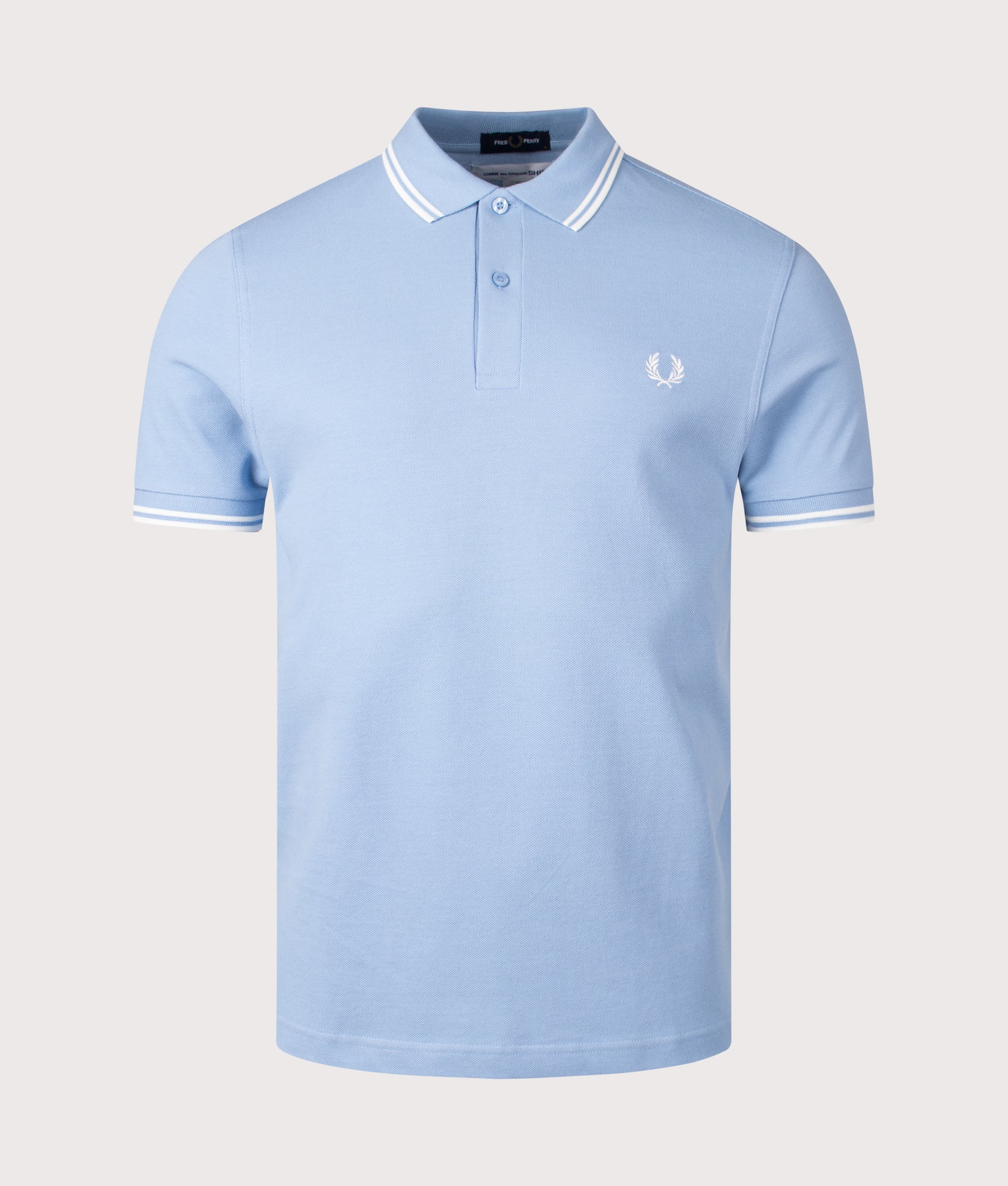 COMME des GARÇONS x Fred Perry Strong Will Polo Shirt. Shot by EQVVS. Front shot.