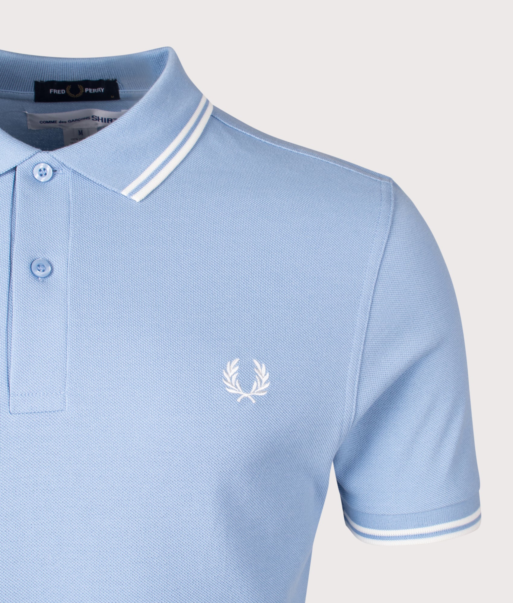 COMME des GARÇONS x Fred Perry Strong Will Polo Shirt. Shot by EQVVS. Detail shot.