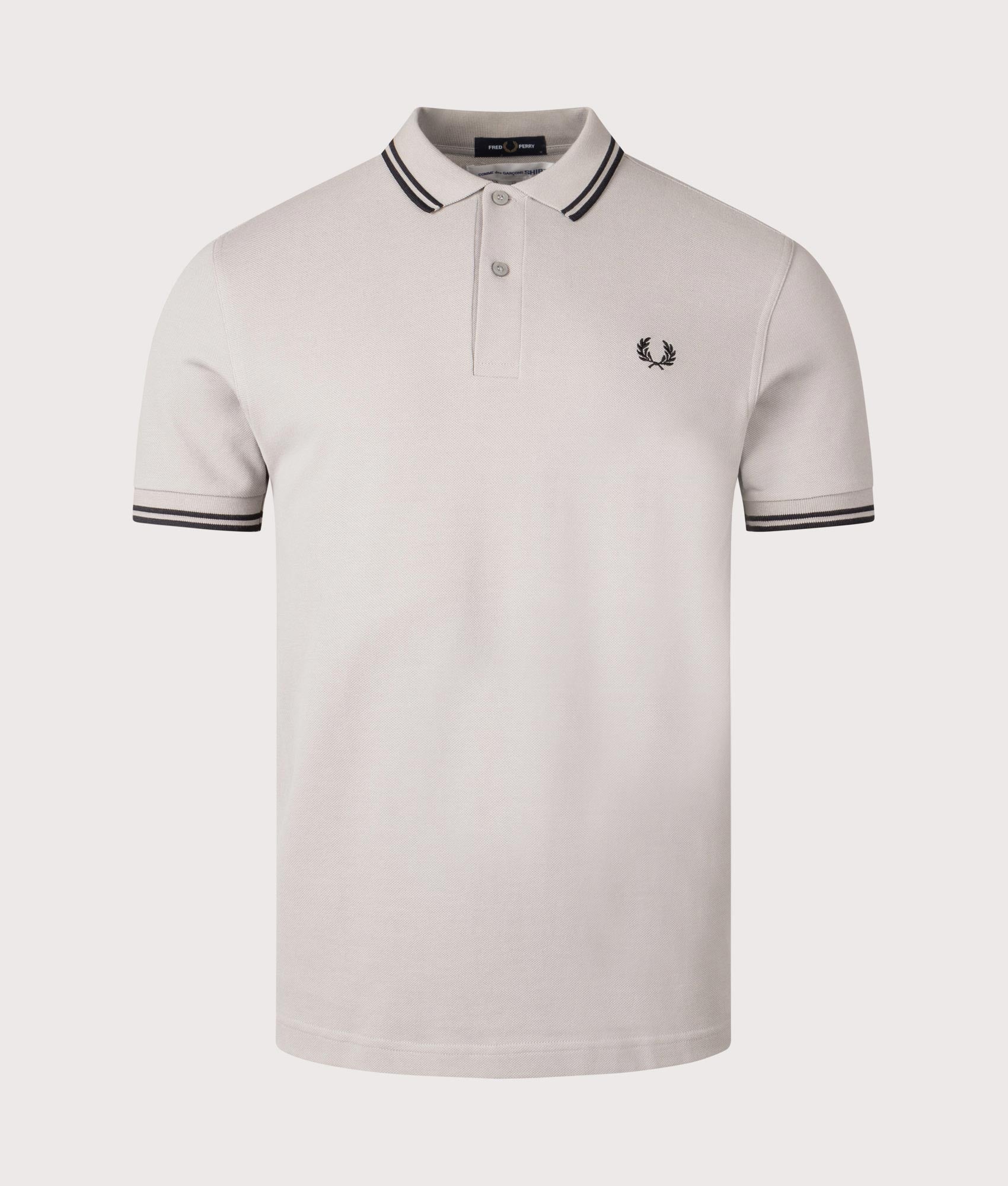 COMME des GARÇONS x Fred Perry Strong Will Polo Shirt. Shot by EQVVS. Front shot.
