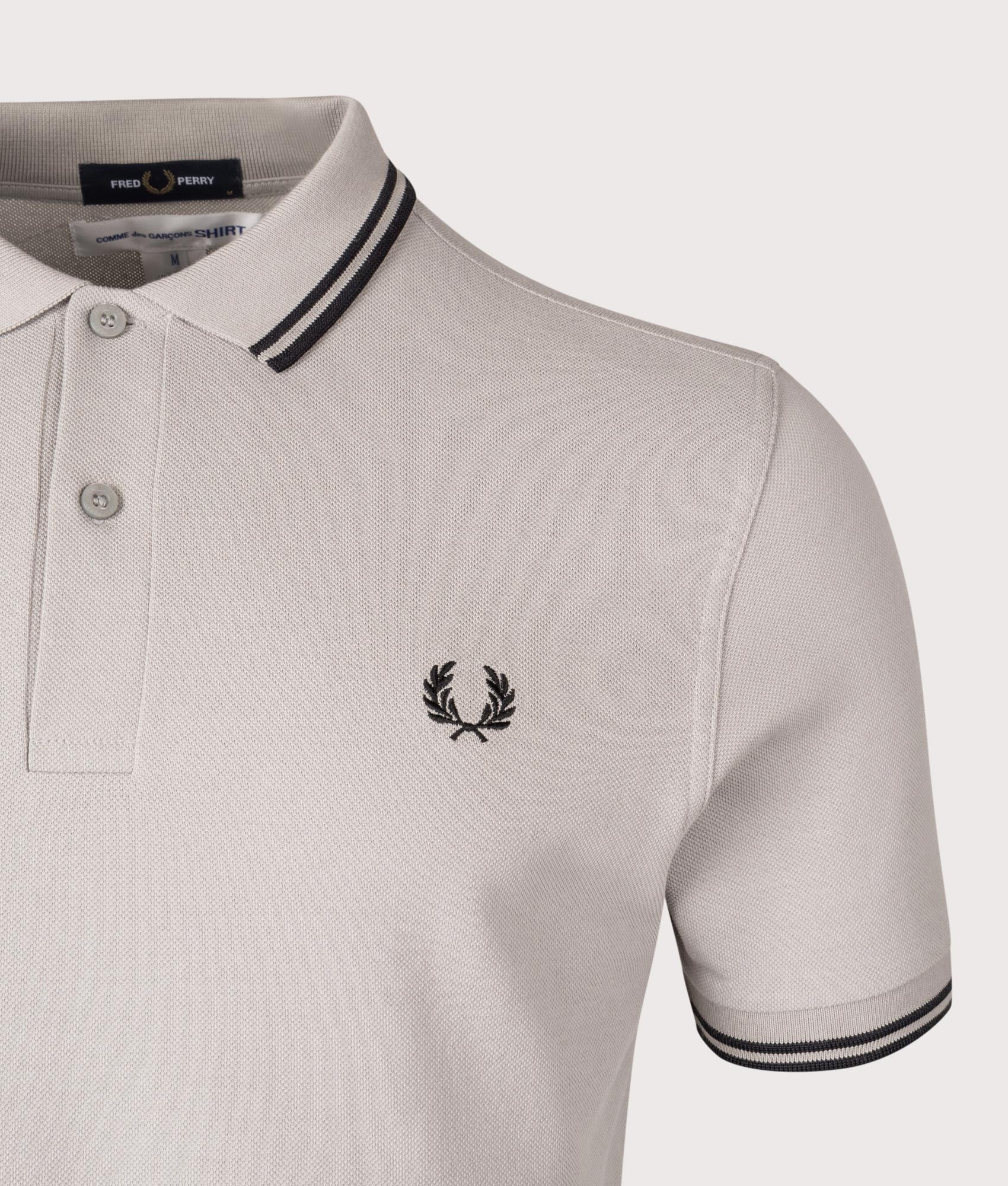 COMME des GARÇONS x Fred Perry Strong Will Polo Shirt. Shot by EQVVS. Detail shot.