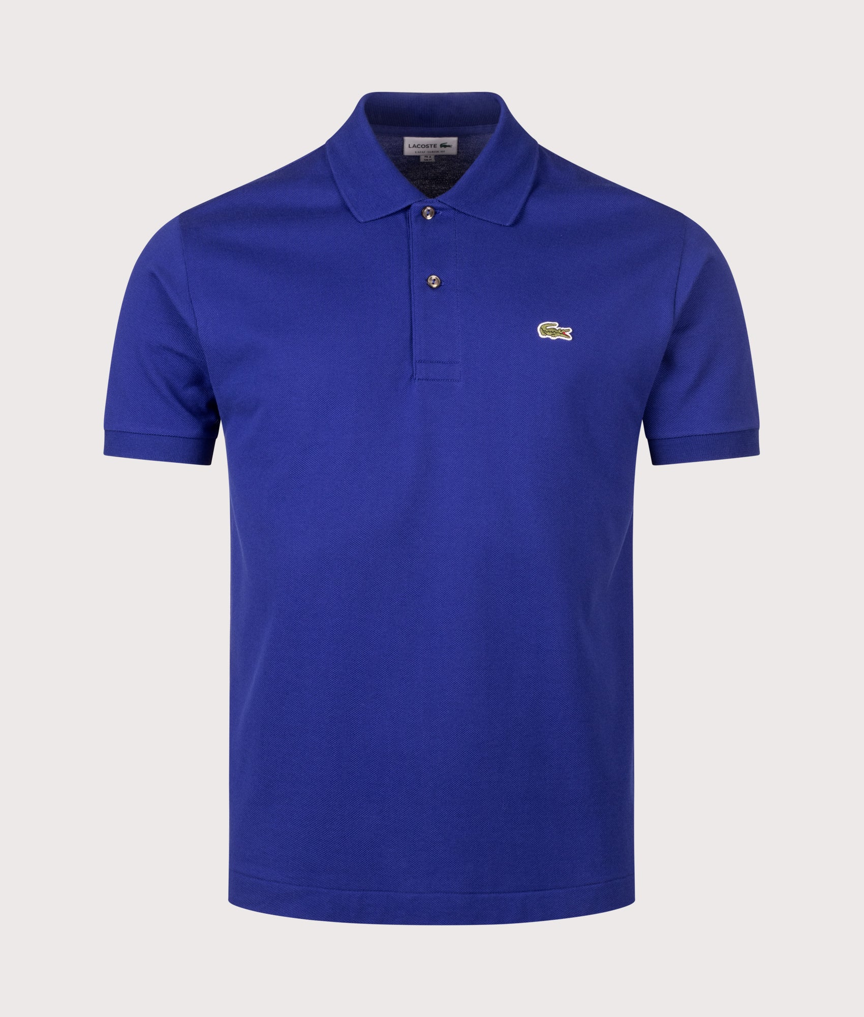 Lacoste Classic Fit L1212 Croc Logo Polo Shirt in Indigo Blue at EQVVS Menswear. Front shot.