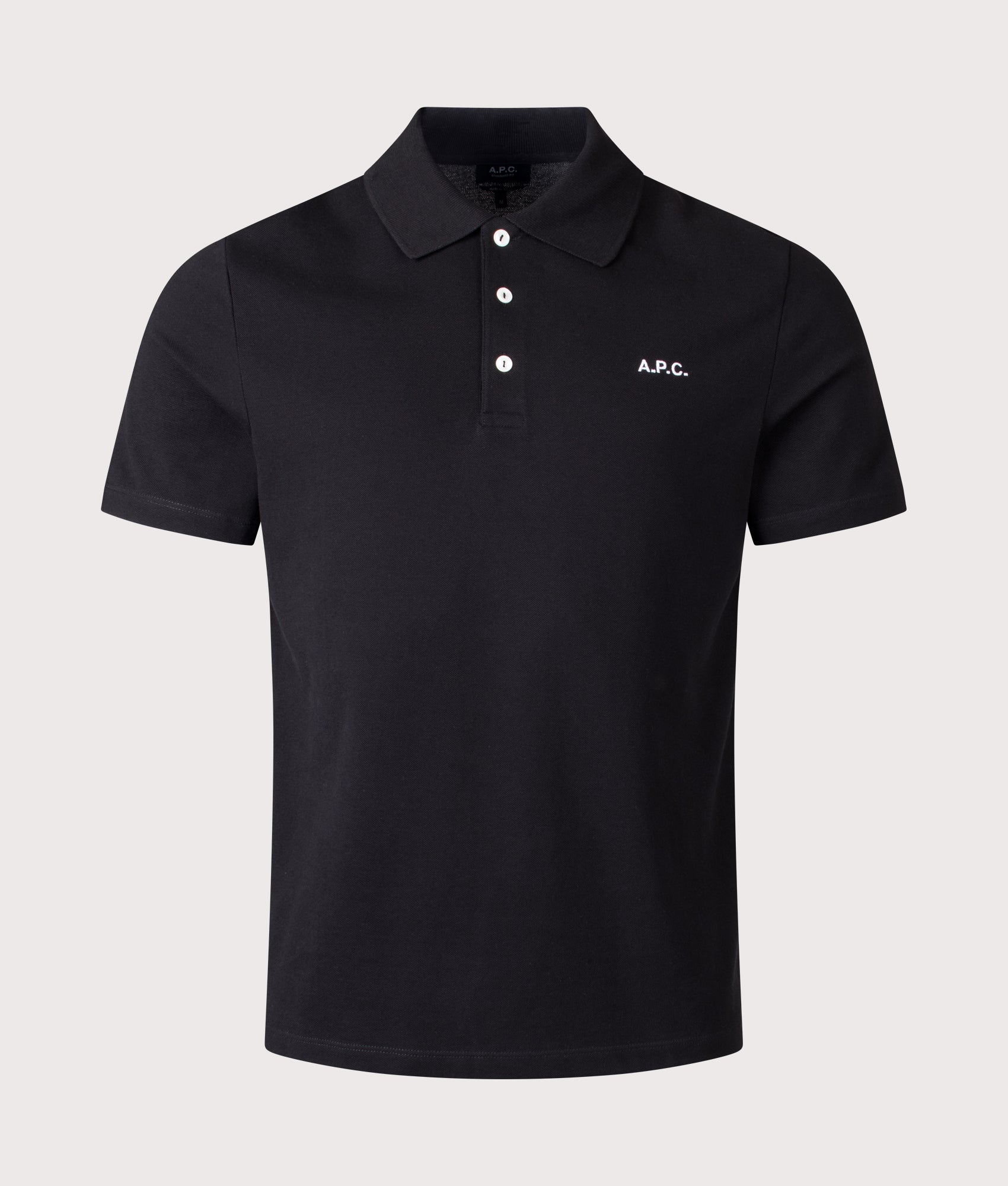 A.P.C. Relaxed Fit Standard Polo Shirt in Black at EQVVS Menswear. Front shot.