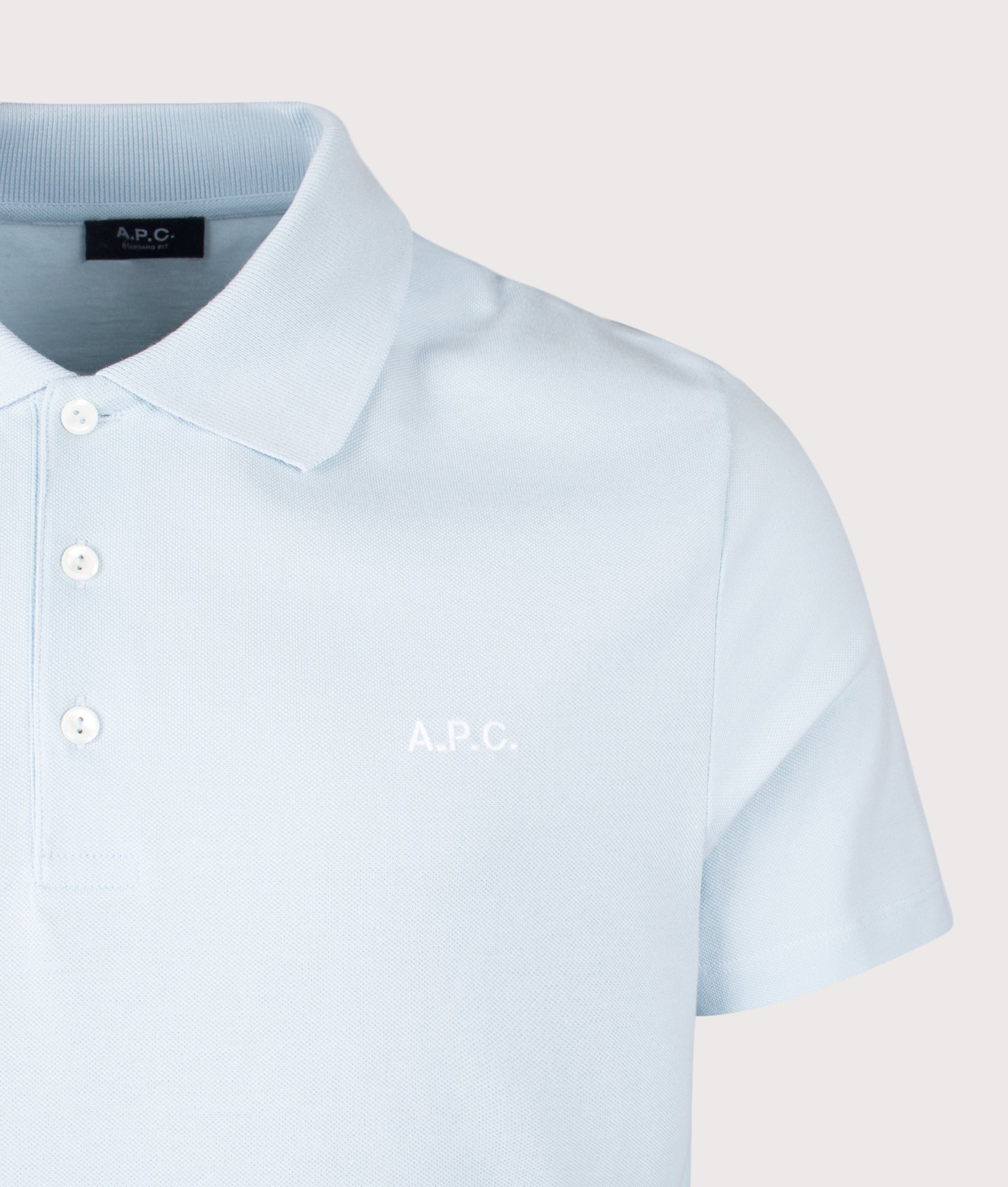 A.P.C. Relaxed Fit Standard Polo Shirt in Sky Blue at EQVVS Menswear. Detail shot.