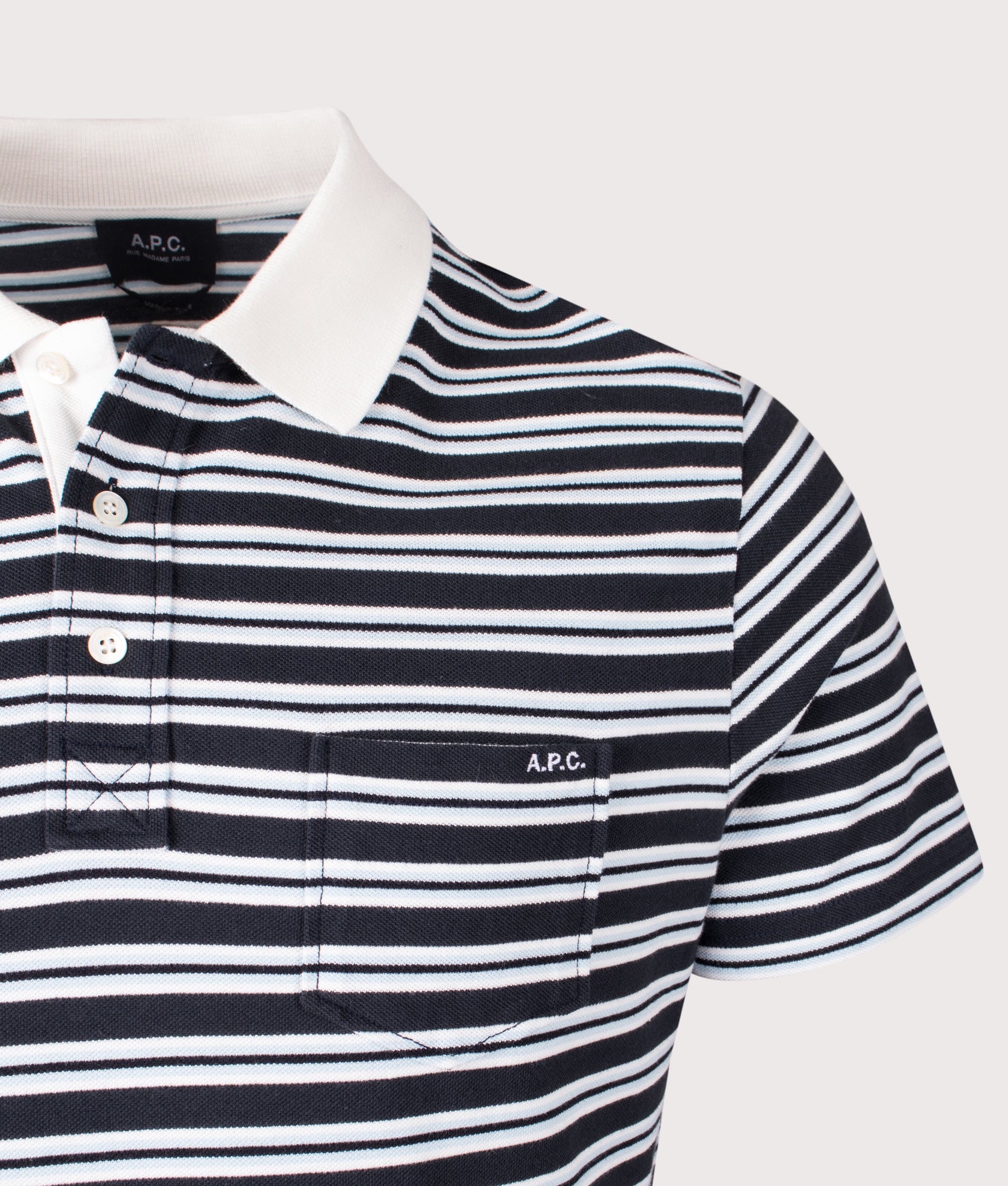 A.P.C. Relaxed fit Oscar Striped Polo Shirt in Dark Navy at EQVVS Menswear. Detail shot.