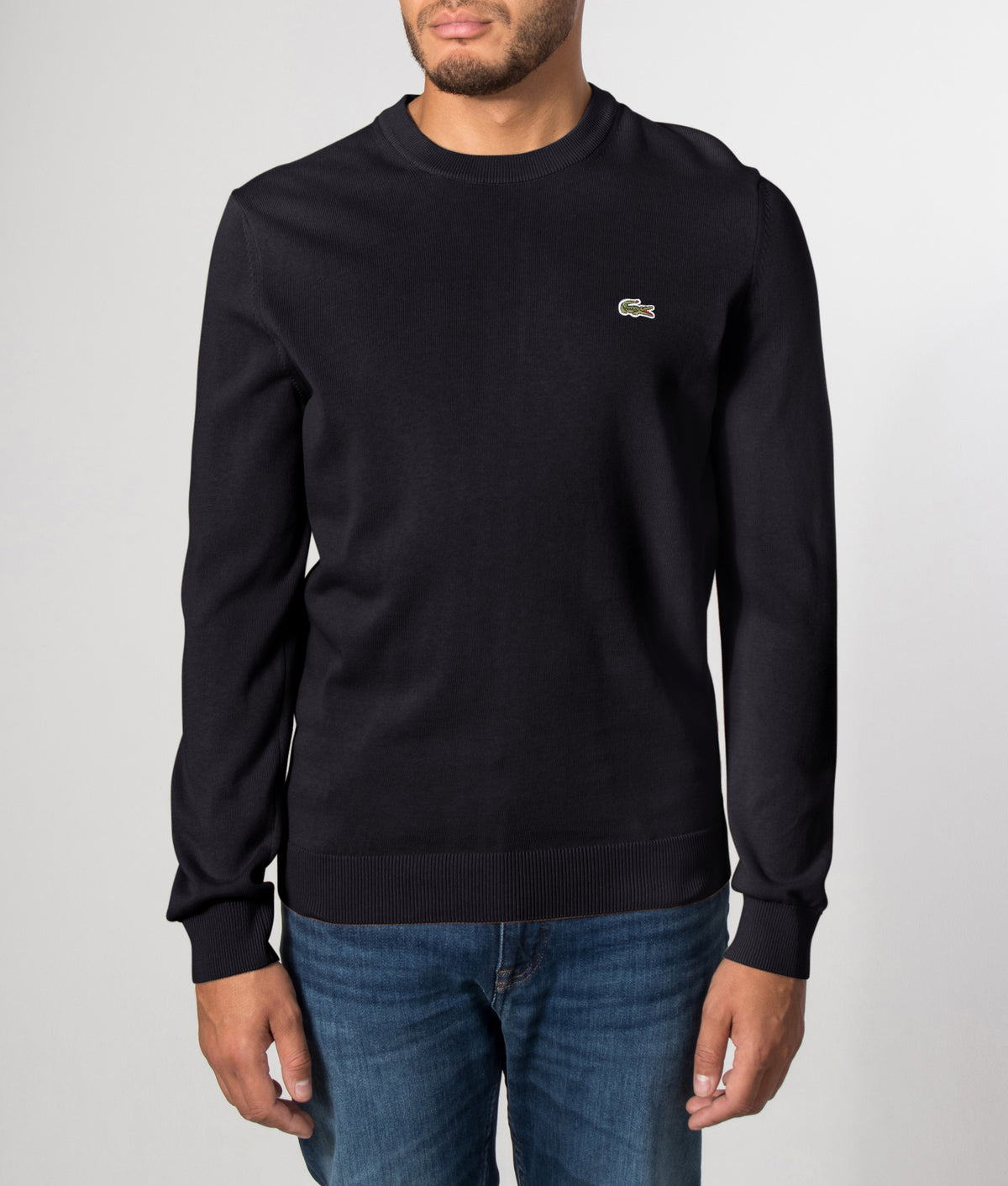 Lacoste Croc Logo Knitted Jumper in Black at EQVVS Menswear. Front model shot. 