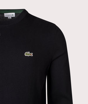 Lacoste Croc Logo Knitted Jumper in Black at EQVVS Menswear. Detail shot.