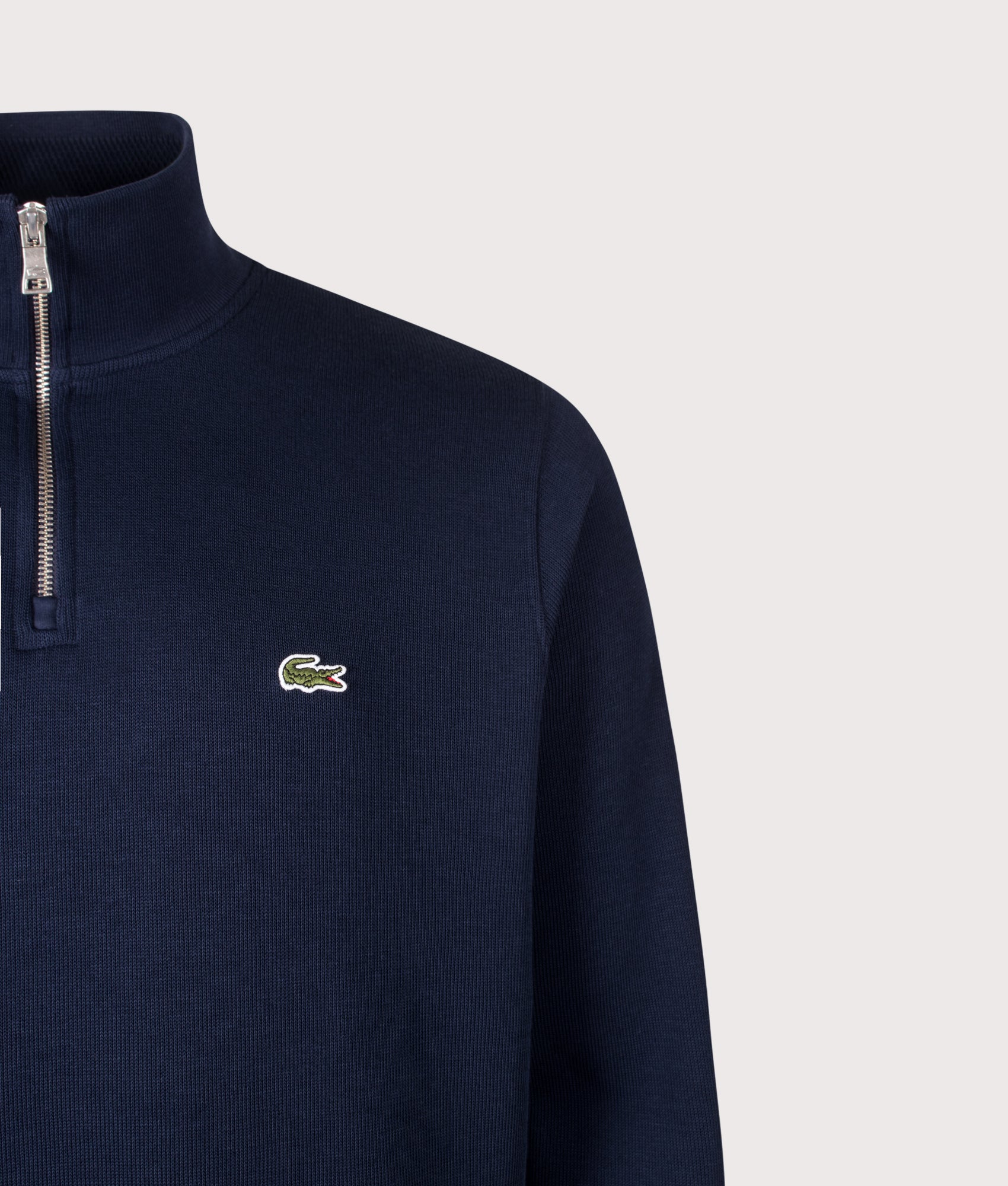 Lacoste Croc Logo Quarter Zip sweatshirt in Navy at EQVVS Menswear. Detail shot.