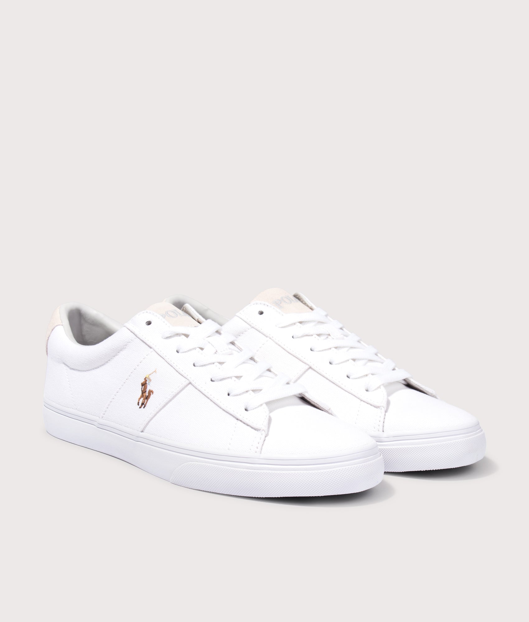 Polo Ralph Lauren Sayer Canvas Sneakers in White at EQVVS Menswear. Angled front shot.
