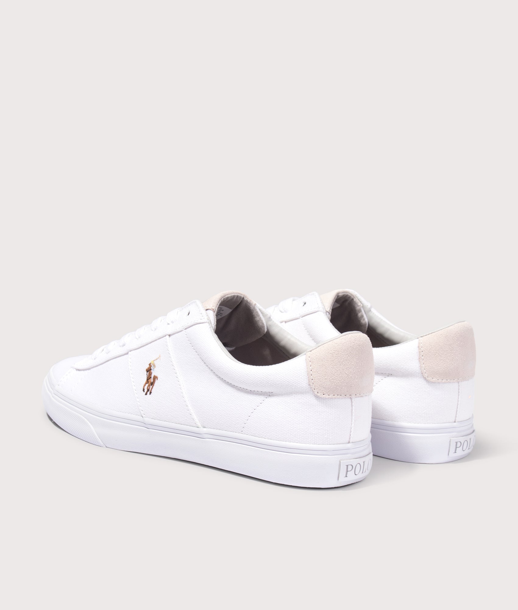 Polo Ralph Lauren Sayer Canvas Sneakers in White at EQVVS Menswear. Angled back shot.