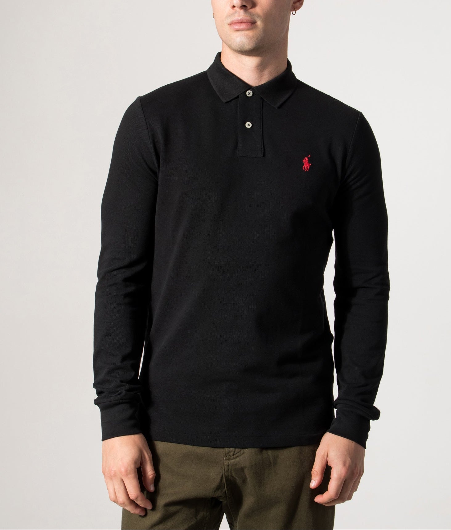 Polo Ralph Lauren Custom Slim Fit Long Sleeve Polo Shirt in Black at EQVVS Menswear. Model front shot.