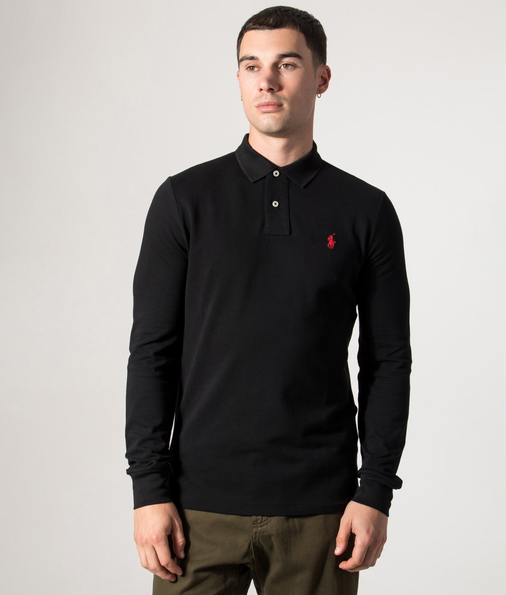 Polo Ralph Lauren Custom Slim Fit Long Sleeve Polo Shirt in Black at EQVVS Menswear. Model front shot.