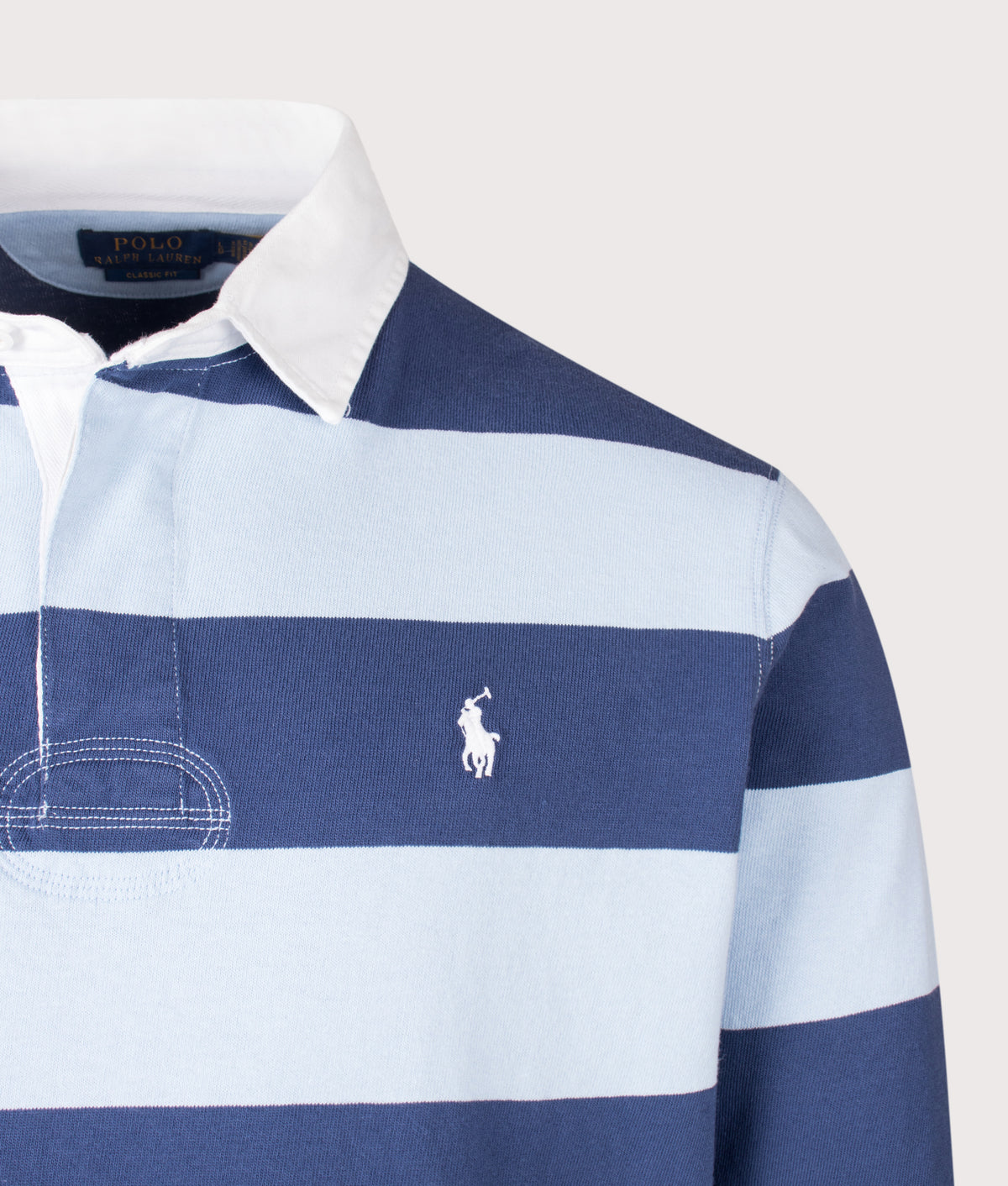Polo Ralph Lauren The Classic Fit Iconic Striped Rugby Shirt in Light Navy and Elite Blue at EQVVS Menswear. Detail shot.