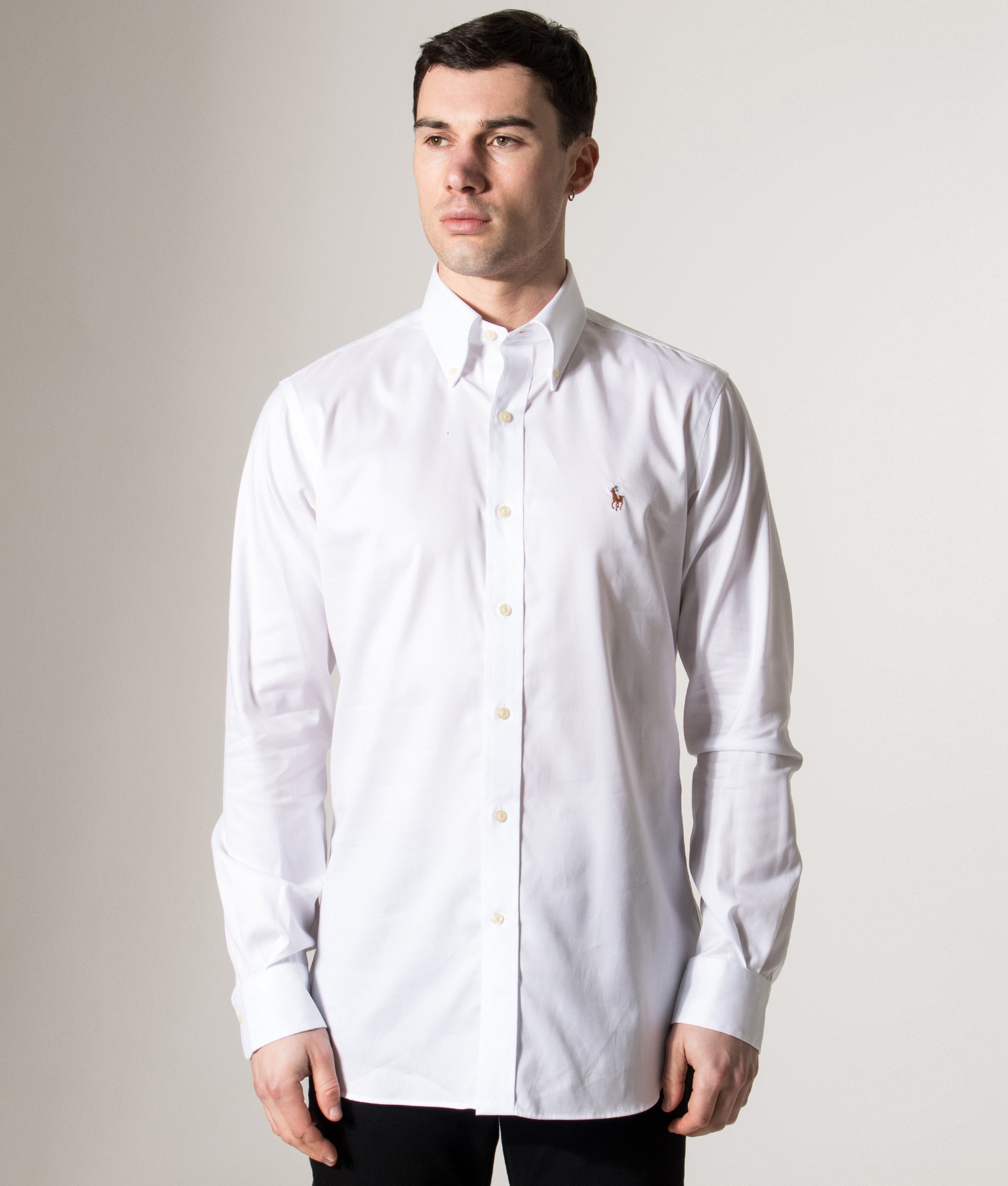 Polo Ralph Lauren Custom Fit Oxford Dress Shirt in White at EQVVS Menswear. Model front shot.