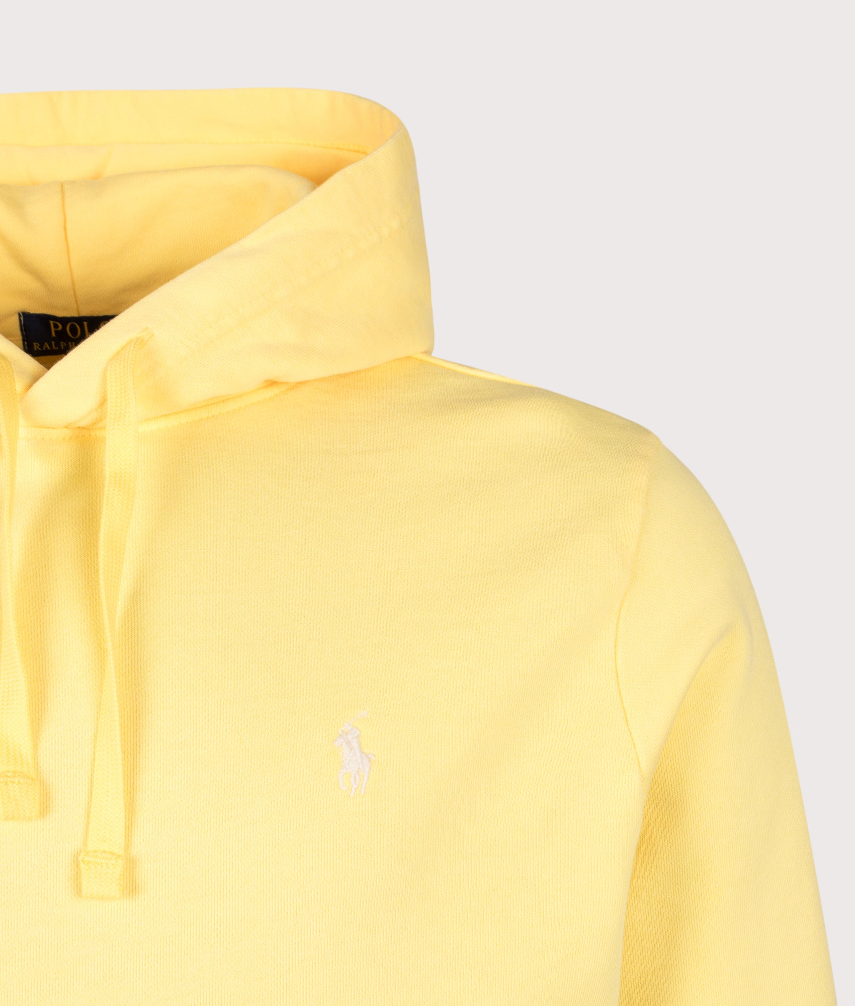 Loopback Fleece Hoodie in Fall Yellow by Polo Ralph Lauren. Shot by EQVVS. Detail shot.
