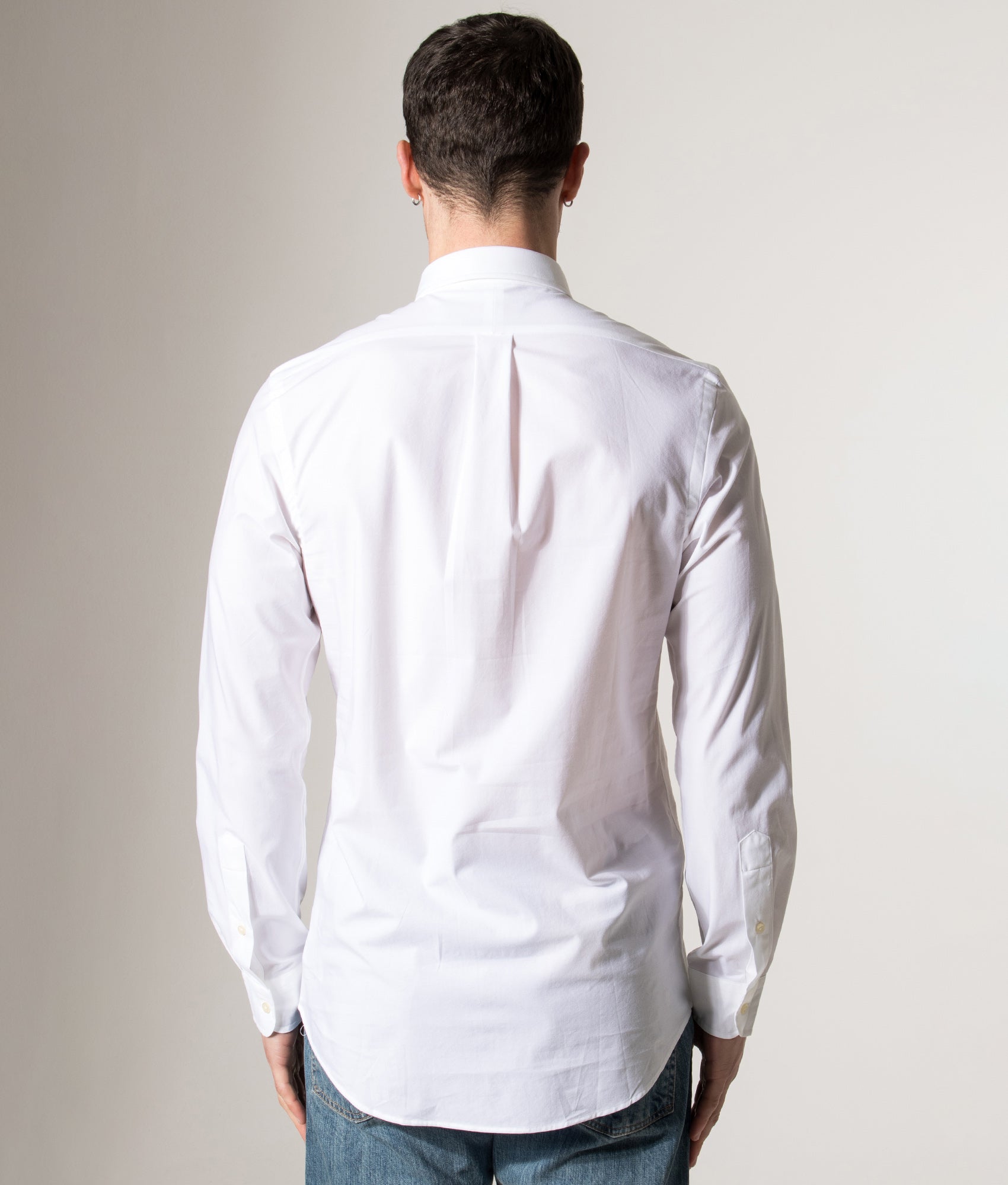 Polo Ralph Lauren Custom Slim Fit Stretch Poplin Shirt in a core white at EQVVS Menswear. Model back shot.