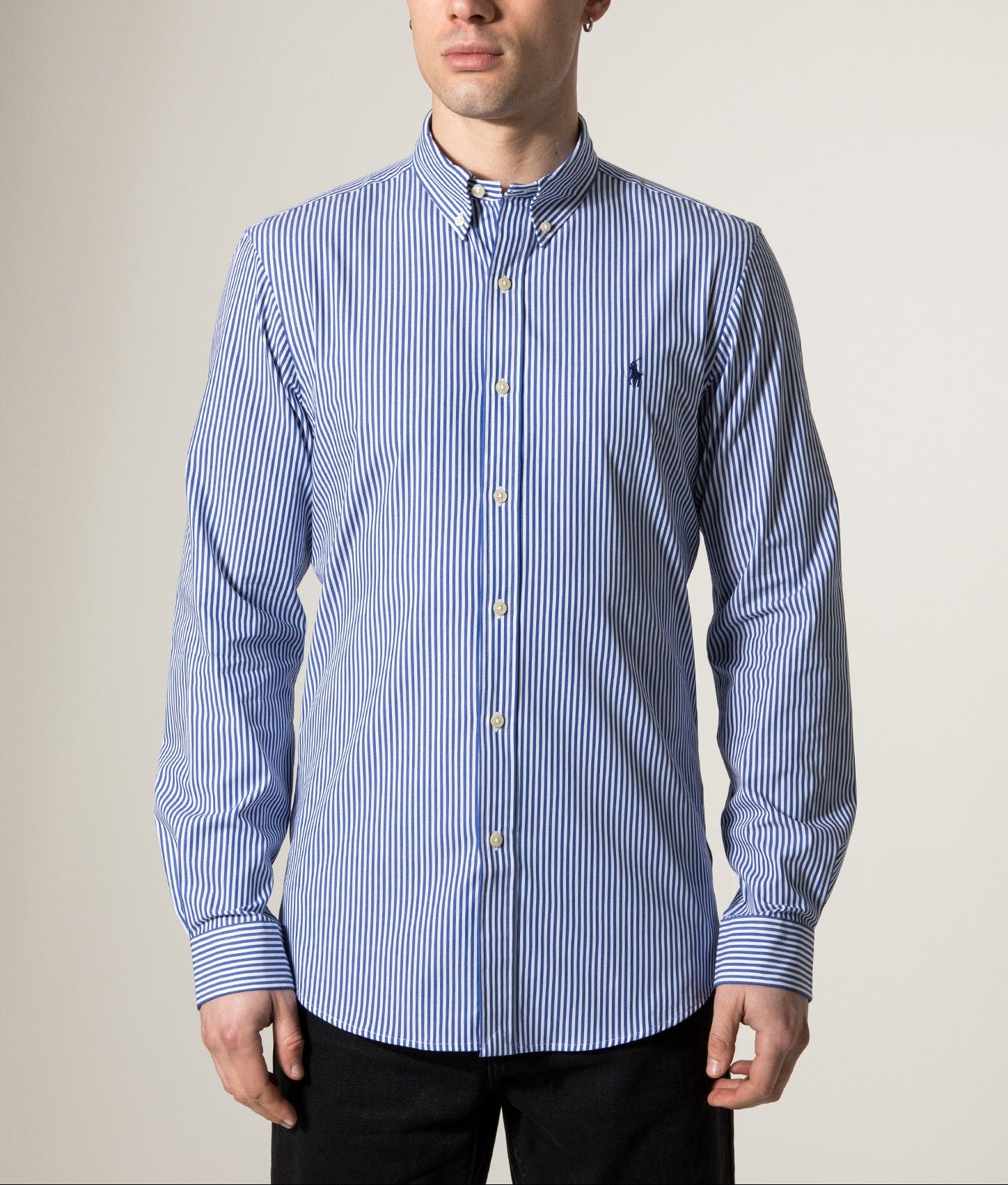 Polo Ralph Lauren Slim Fit Stretch Poplin Shirt in Blue and White Bengal Stripe at EQVVS Menswear. Model front shot.