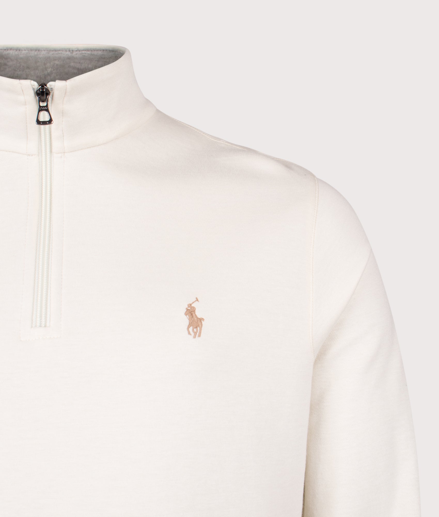 Polo Ralph Lauren Quarter Zip Sweatshirt in Parchment Cream at EQVVS Menswear. Detail shot.