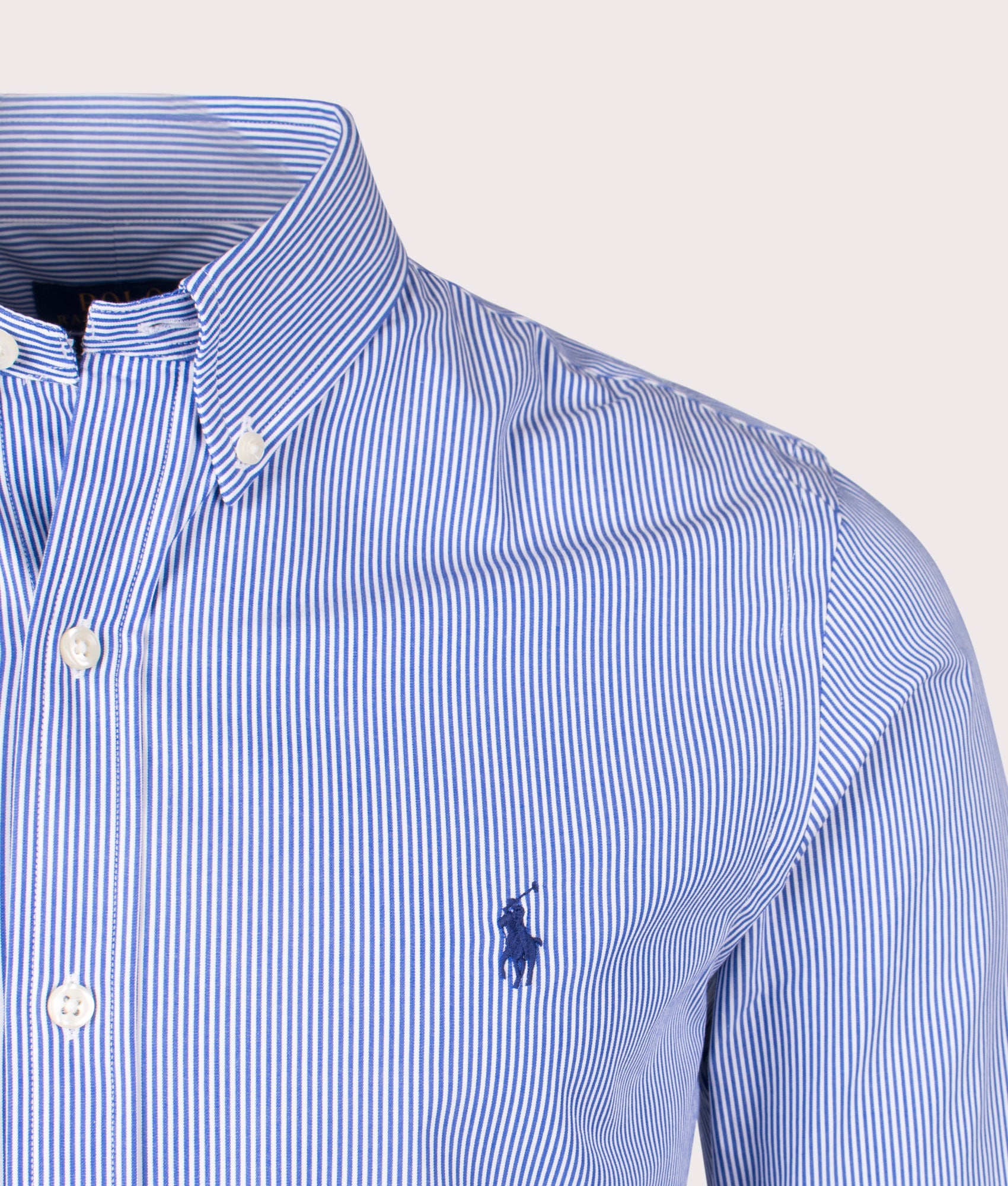 Stretch Slim Fit Poplin Shirt in blue by Polo Ralph Lauren. Shot at EQVVS. Detail shot. 