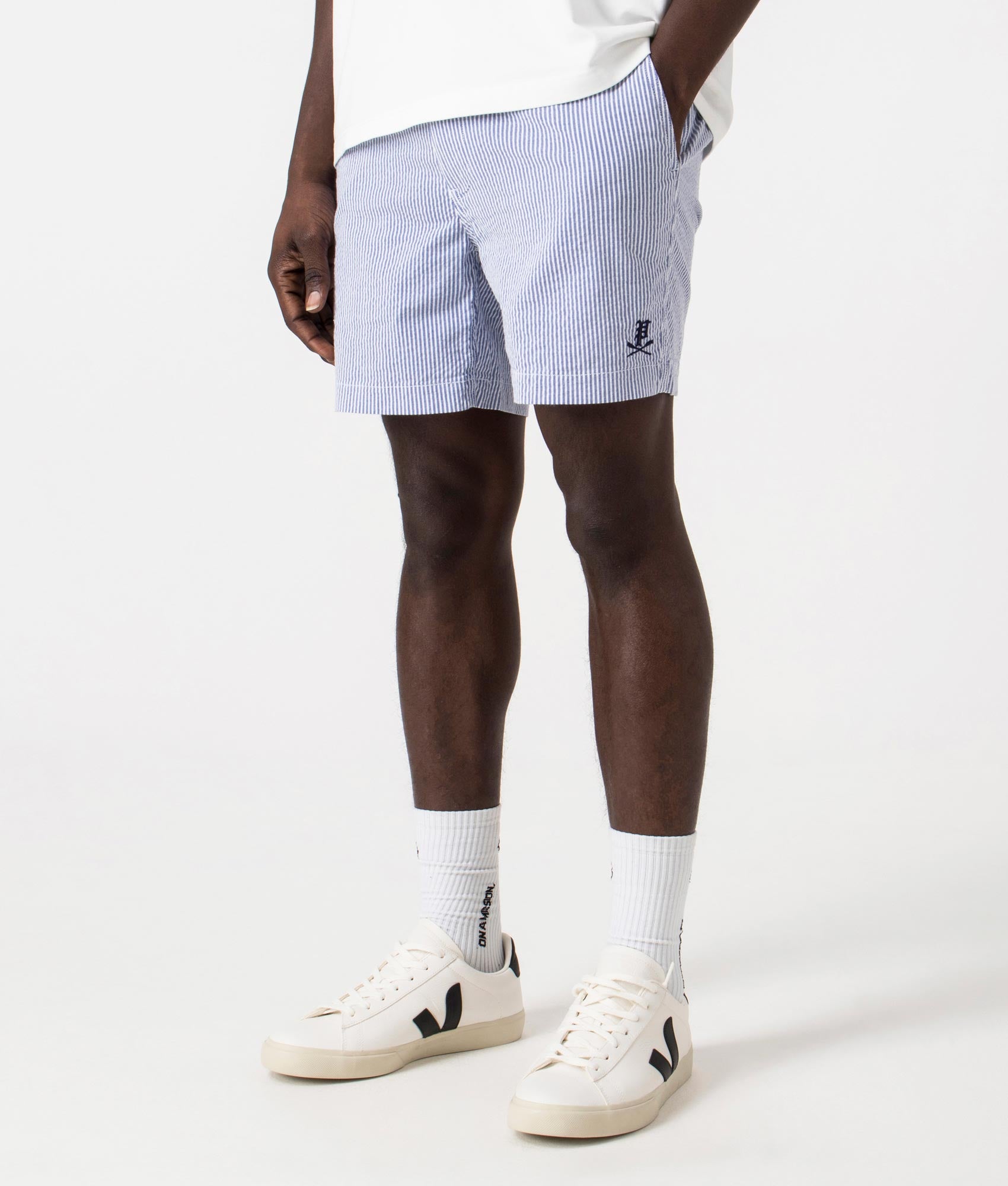 Classic Fit Prepster Seersucker Shorts in Seersucker Blue with Gothic Emblem, Front Angle Model Shot at EQVVS