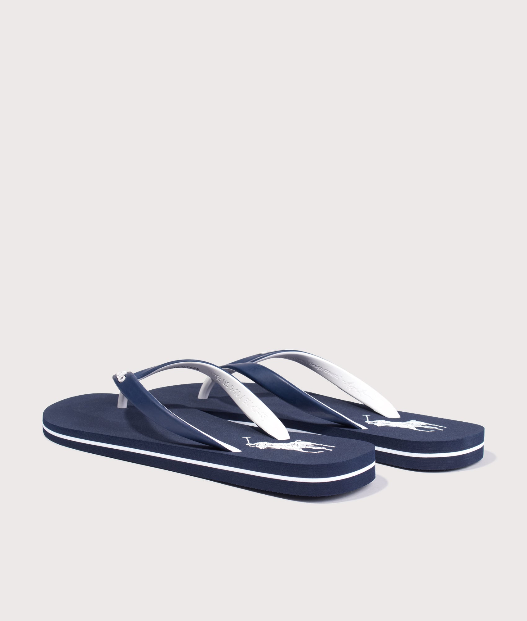 Polo Ralph Lauren Bolt Big Pony Flip Flops in Navy and White at EQVVS Menswear. Angled back shot.