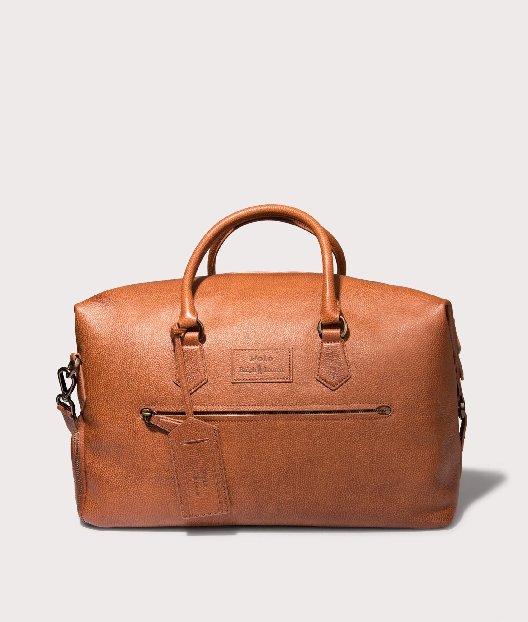 Polo Ralph Lauren Pebbled Leather Duffel Bag in Saddle . Shot at EQVVS.  Side front shot 