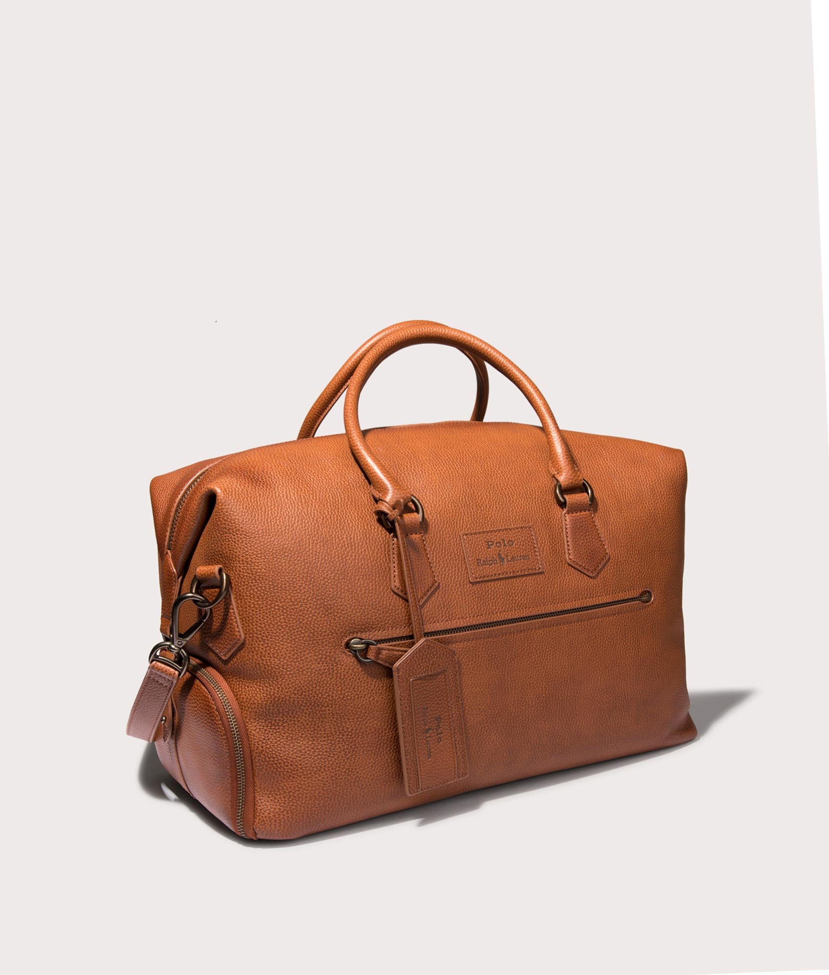 Polo Ralph Lauren Pebbled Leather Duffel Bag in Saddle . Shot at EQVVS. Angle shot 