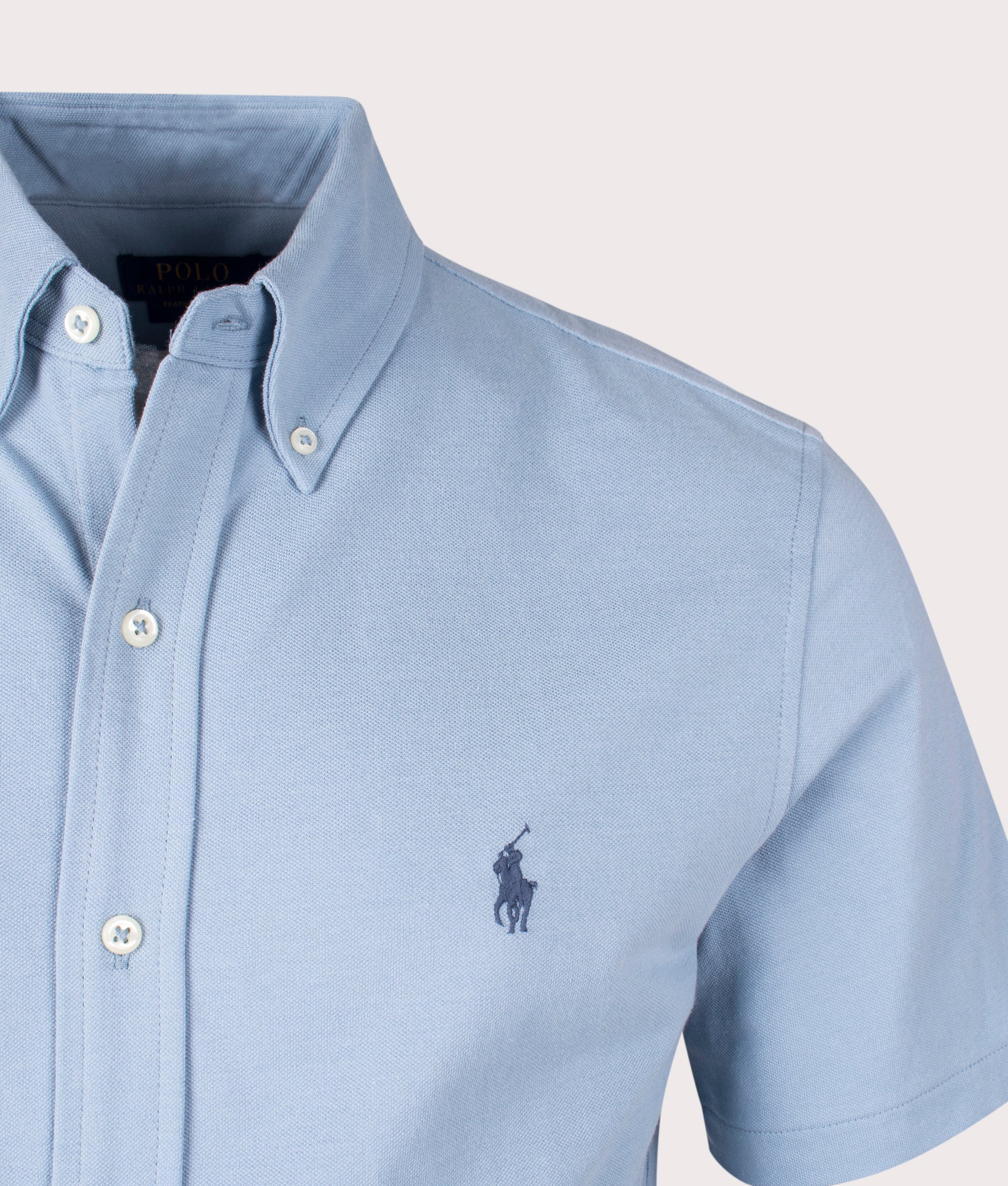 Polo Ralph Luren Featherweight Mesh Short Sleeve Shirt in Vessel Blue. Detail angle shot at EQVVS.