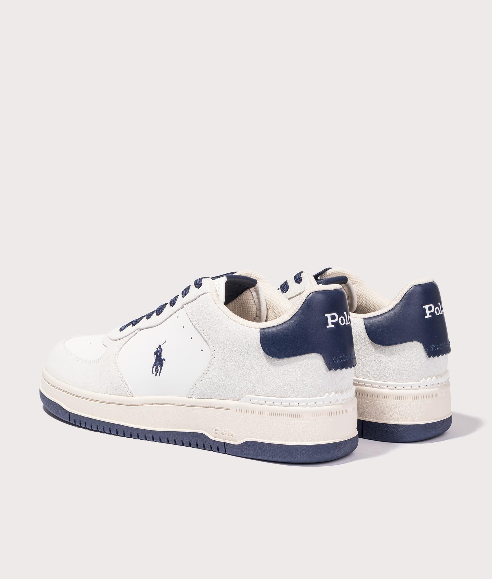 Masters Court Leather-Suede Trainers in Deckwash White/Navy from Polo Ralph Lauren. Back side angle shot at EQVVS.