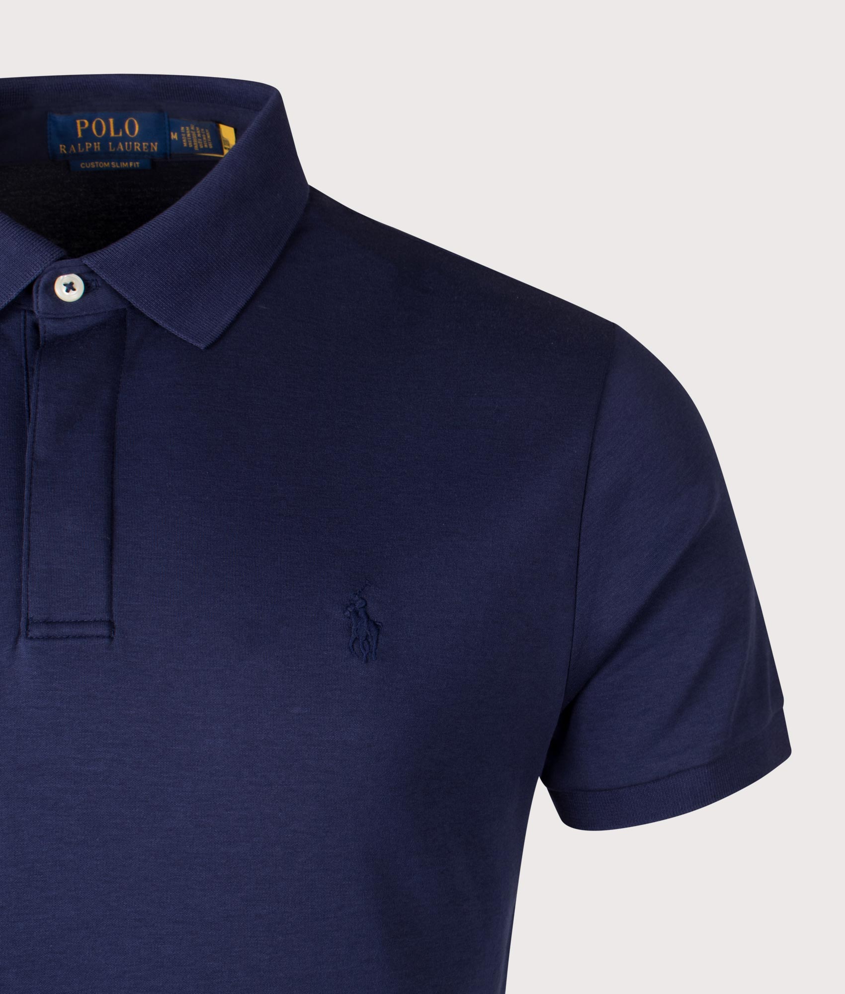 Custom Slim Fit Polo Shirt. Shot by EQVVS. Front detail shot.