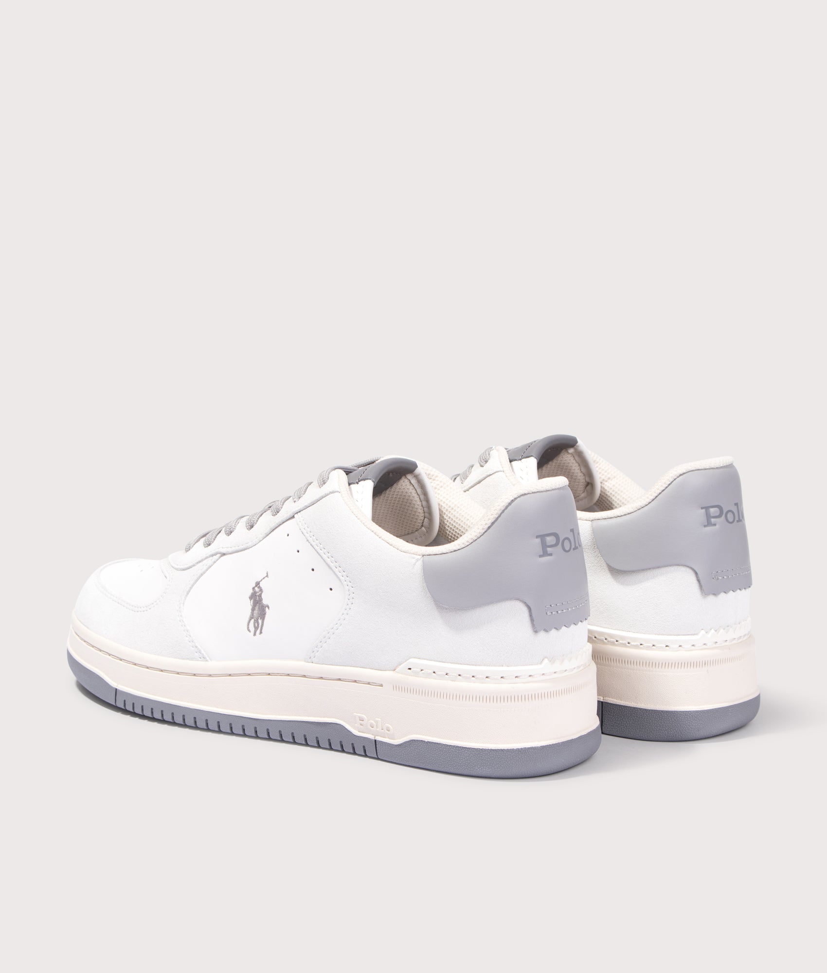 Polo Ralph Lauren Masters Court Leather Suede Trainers in Masters Court Leather Suede Trainers in Deckwash White/Grey. Back side angle shot at EQVVS.