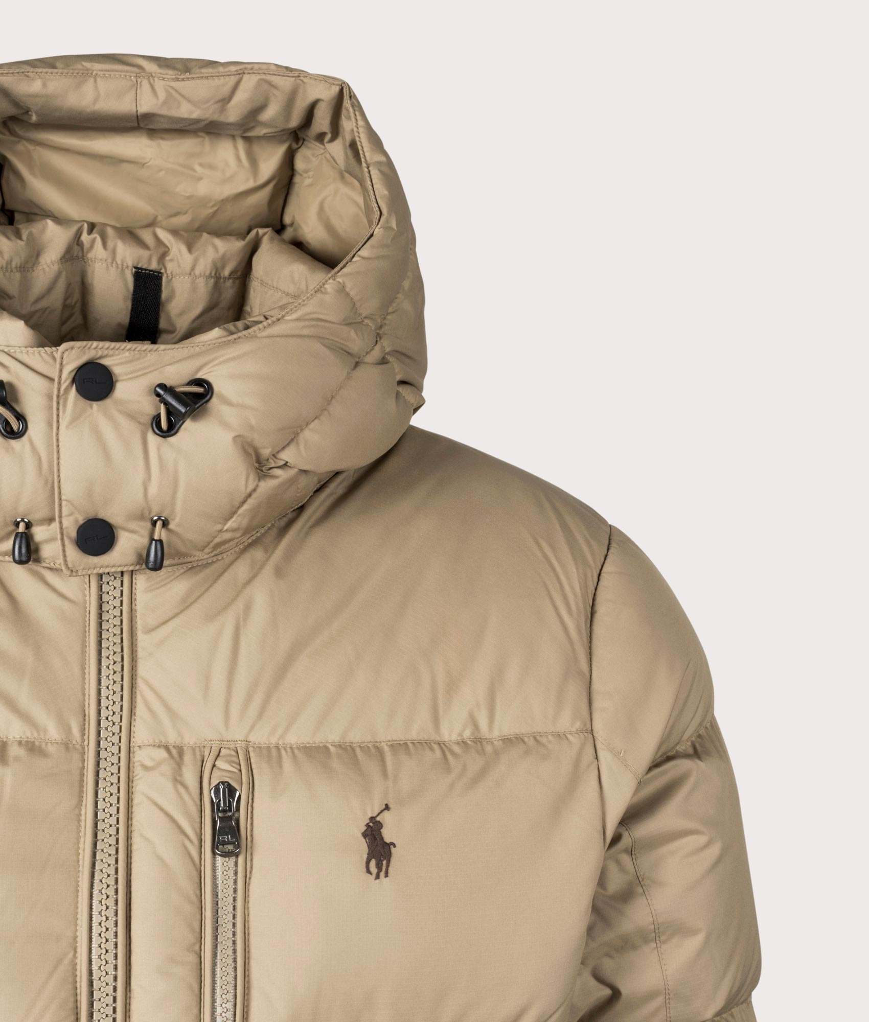 The Polo Ralph Lauren Gorham Down Jacket in Desert Khaki at EQVVS. Detailed Logo Shot. 