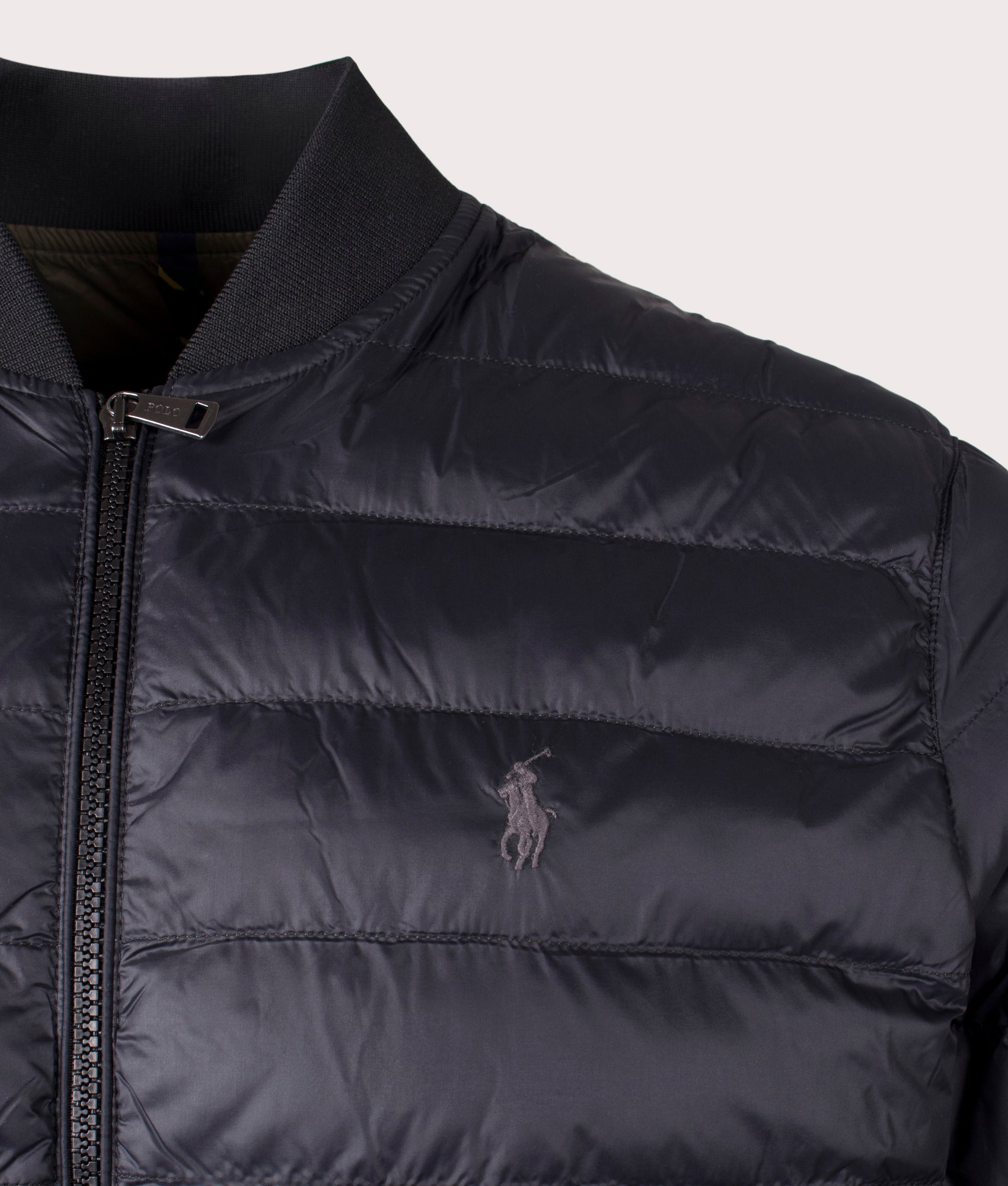 The Colden Packable Bomber Jacket in Polo Black from Polo Ralph Lauren. Detail angle shot at EQVVS.